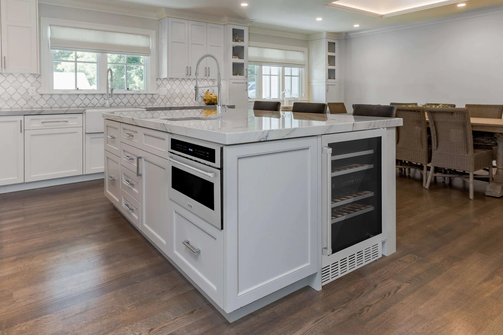 Stainless steel wine cooler in kitchen cabinetry with dark interior shelves