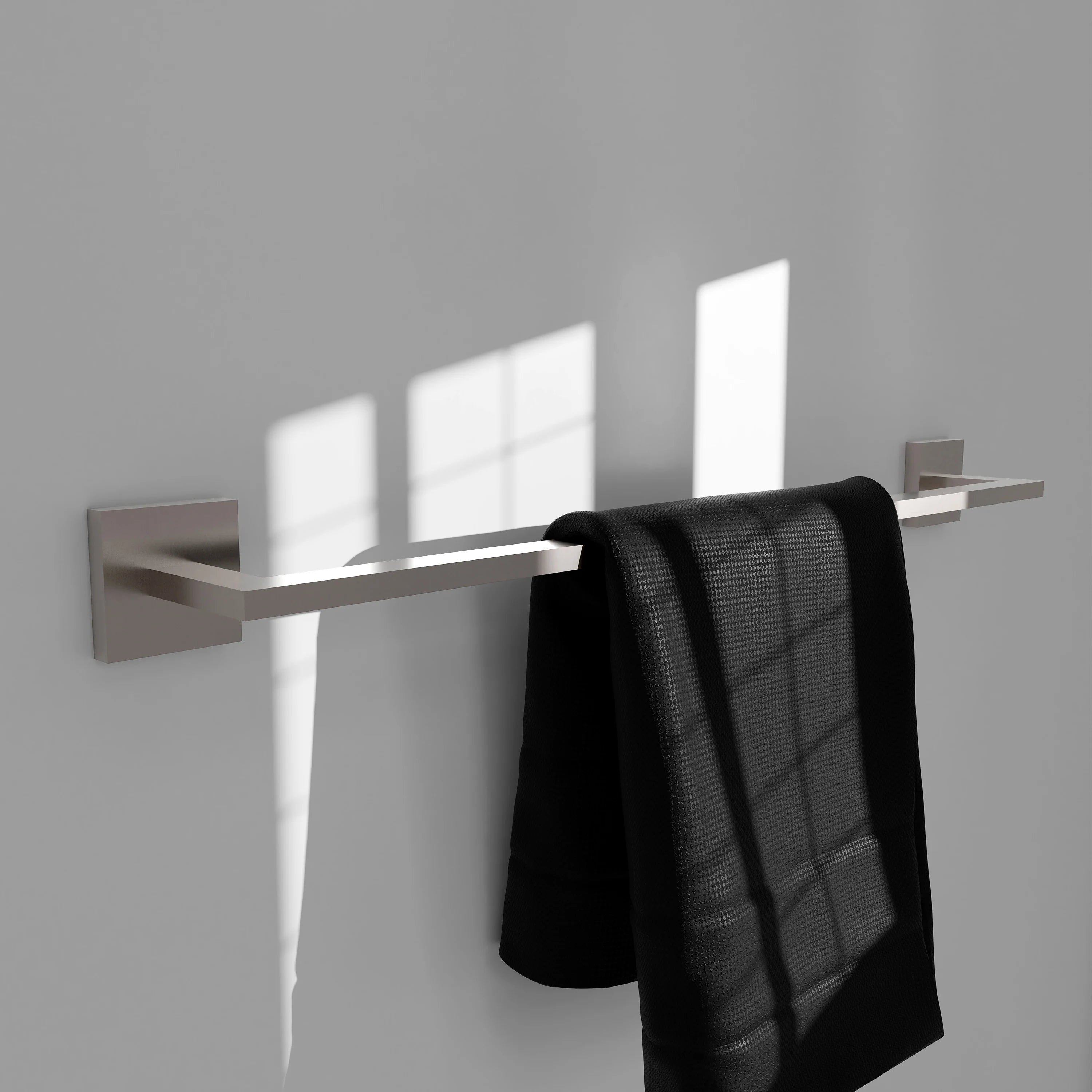 24-inch brushed nickel towel rail holding a folded black towel