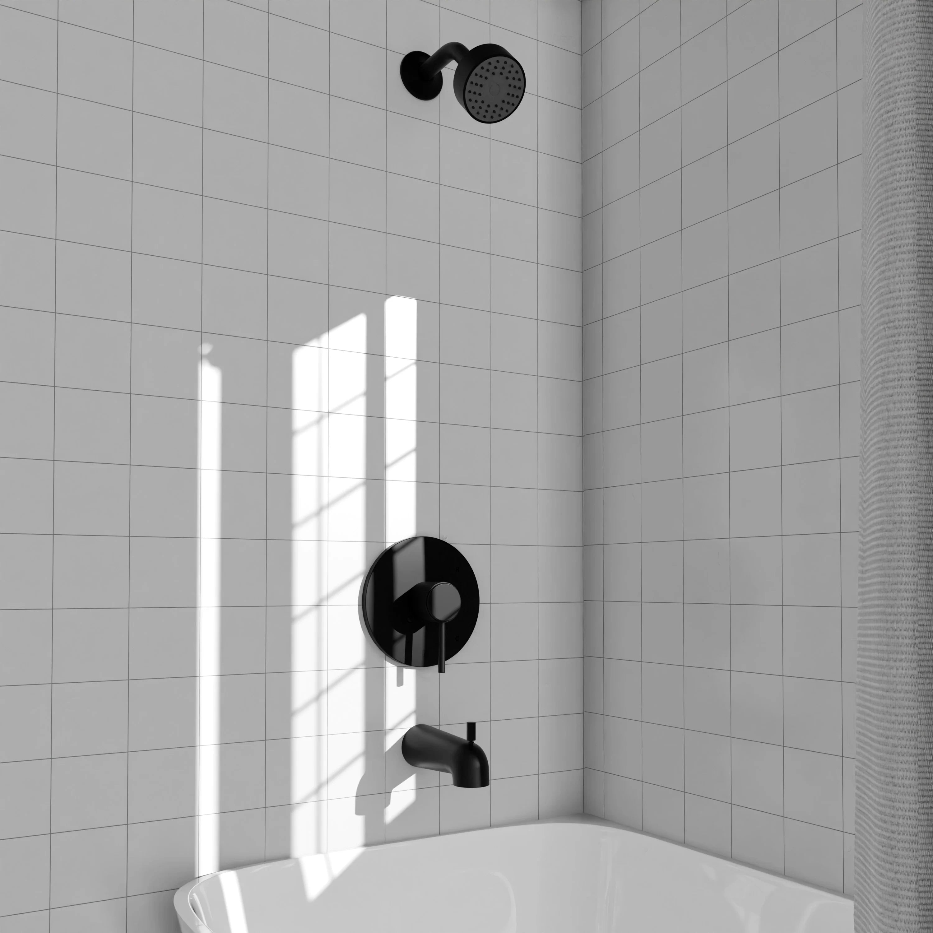 Matte black shower control trim with showerhead above and round wall plate