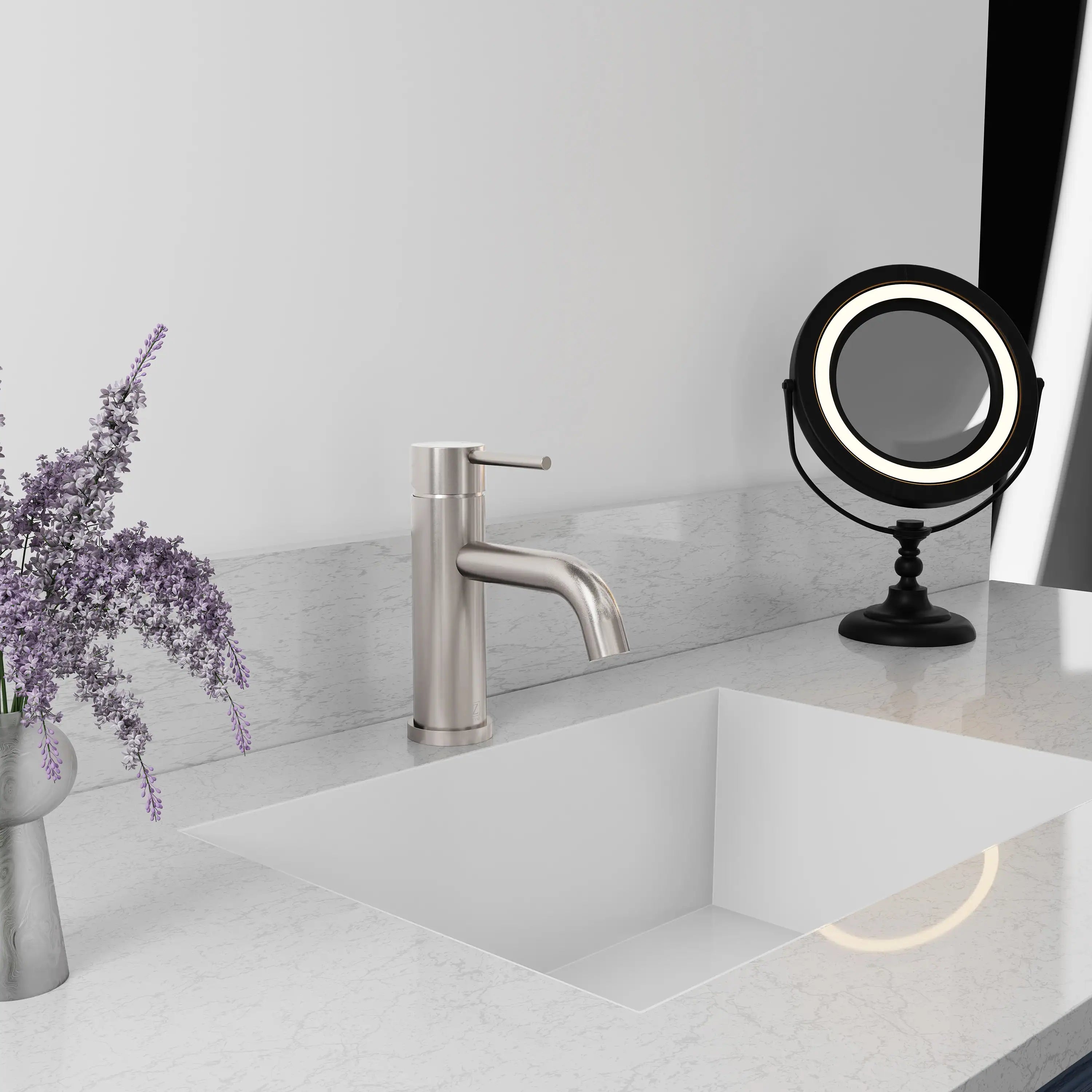 Single-handle bath faucet with curved spout and brushed nickel finish on vanity basin