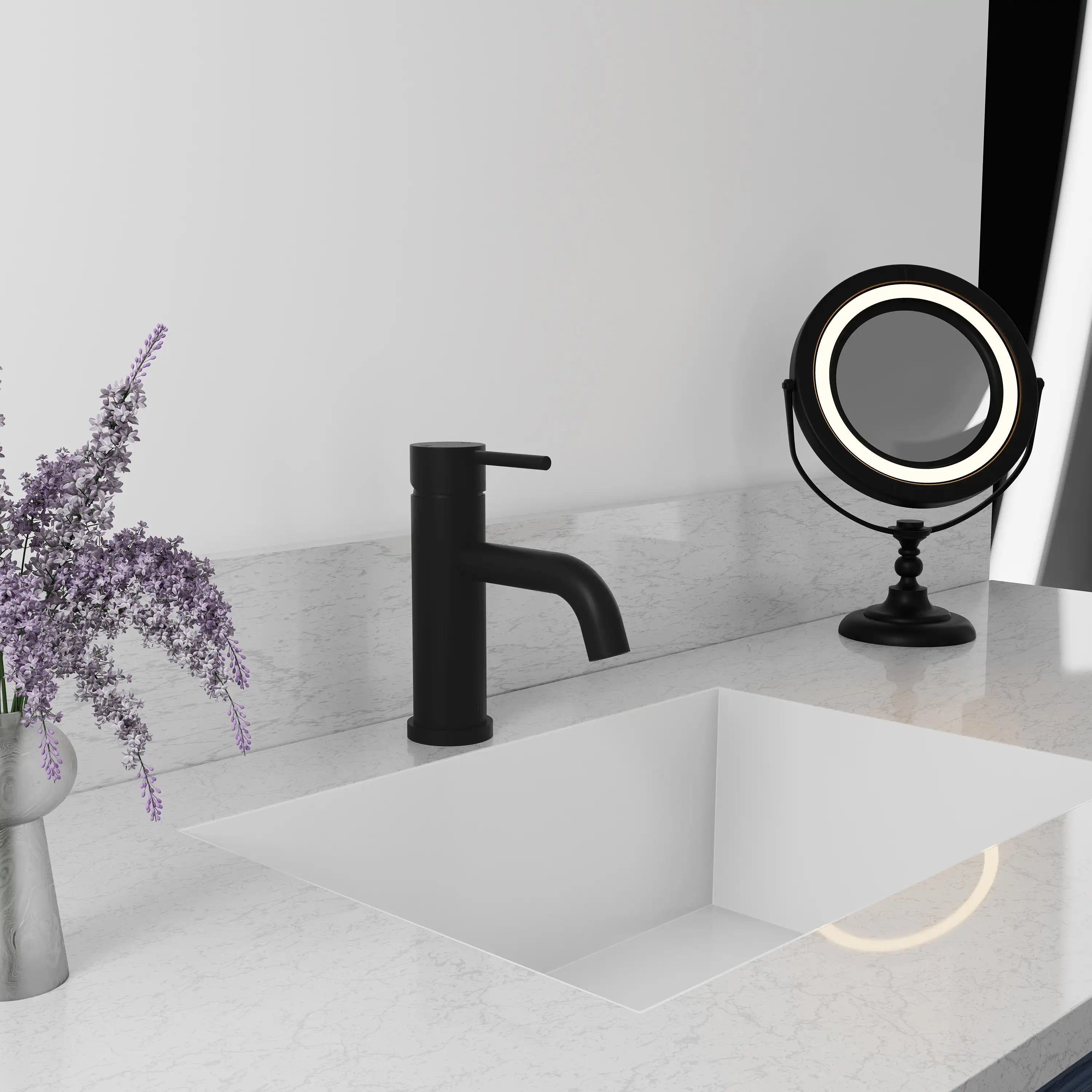 Matte black single-handle bath faucet on vanity sink with exposed spout and handle