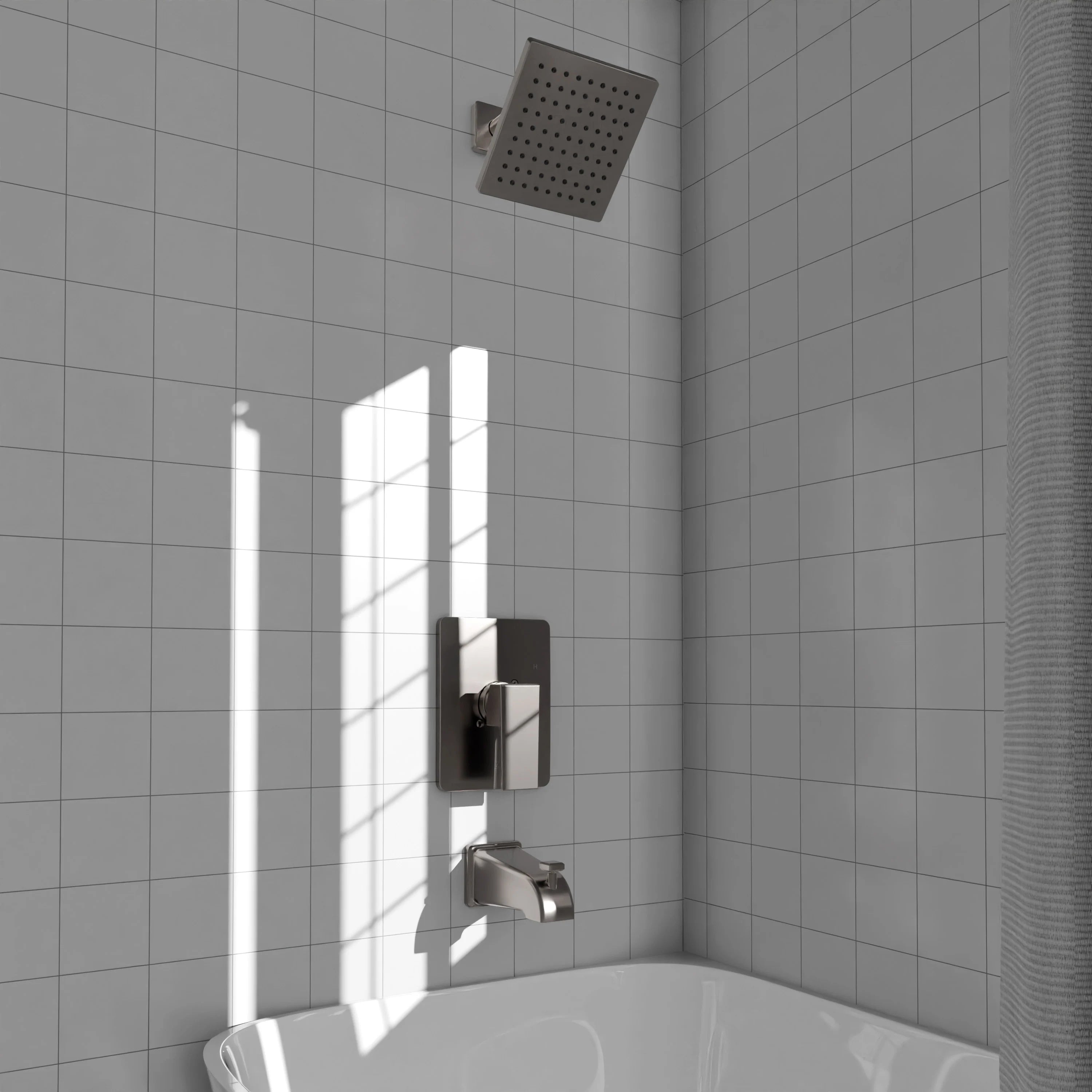 Brushed nickel shower valve with square showerhead mounted on a tiled wall