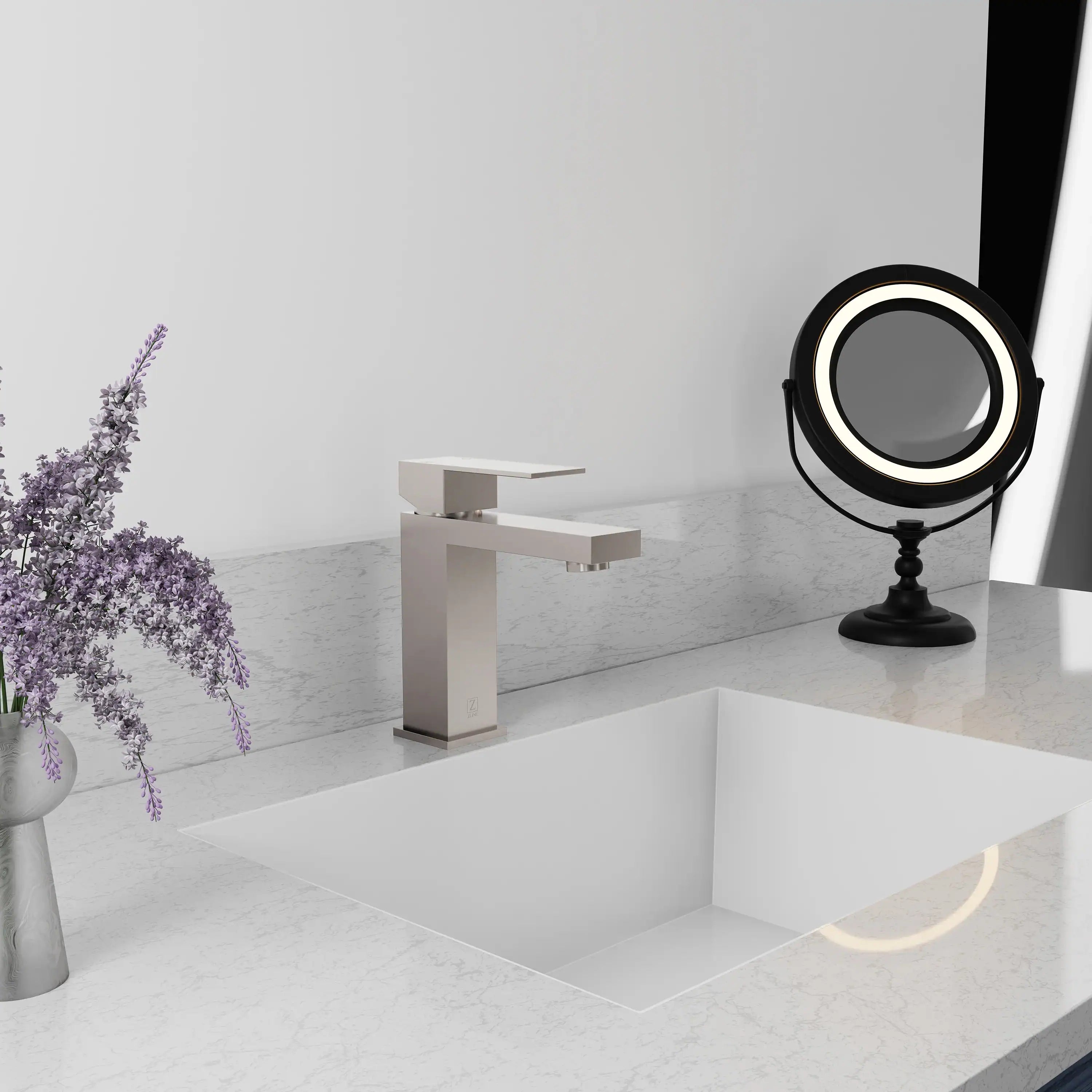 Modern brushed nickel single-handle bath faucet with square spout and clean geometric body.