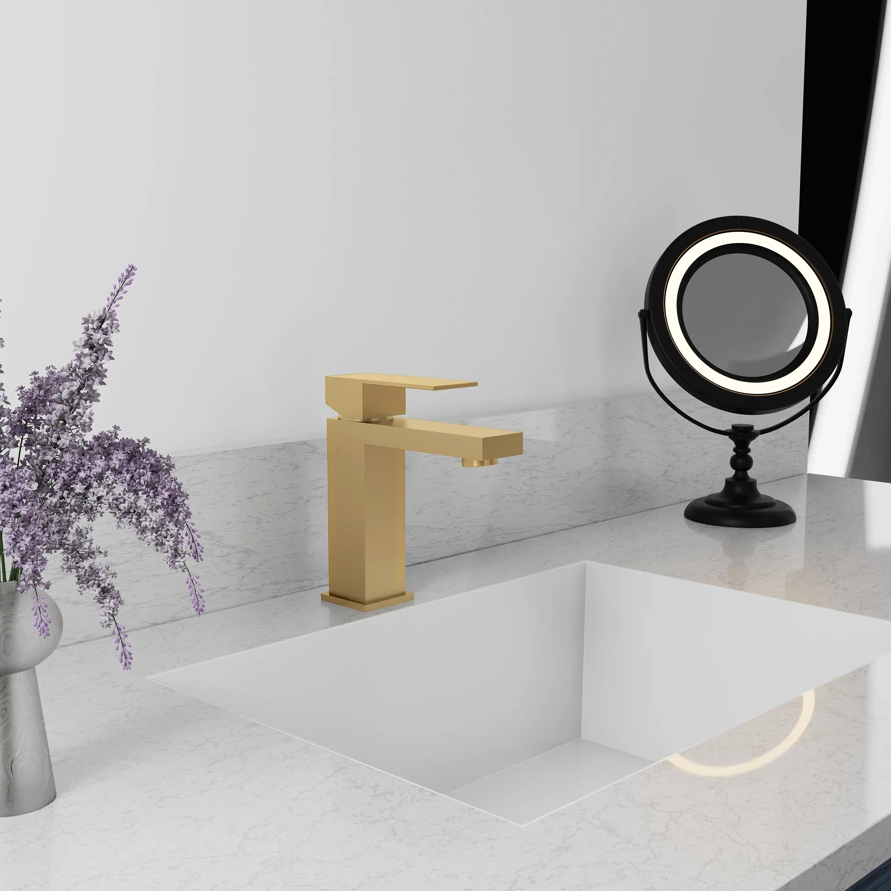 Champagne bronze single-handle bath faucet with rectangular spout on vanity ledge.