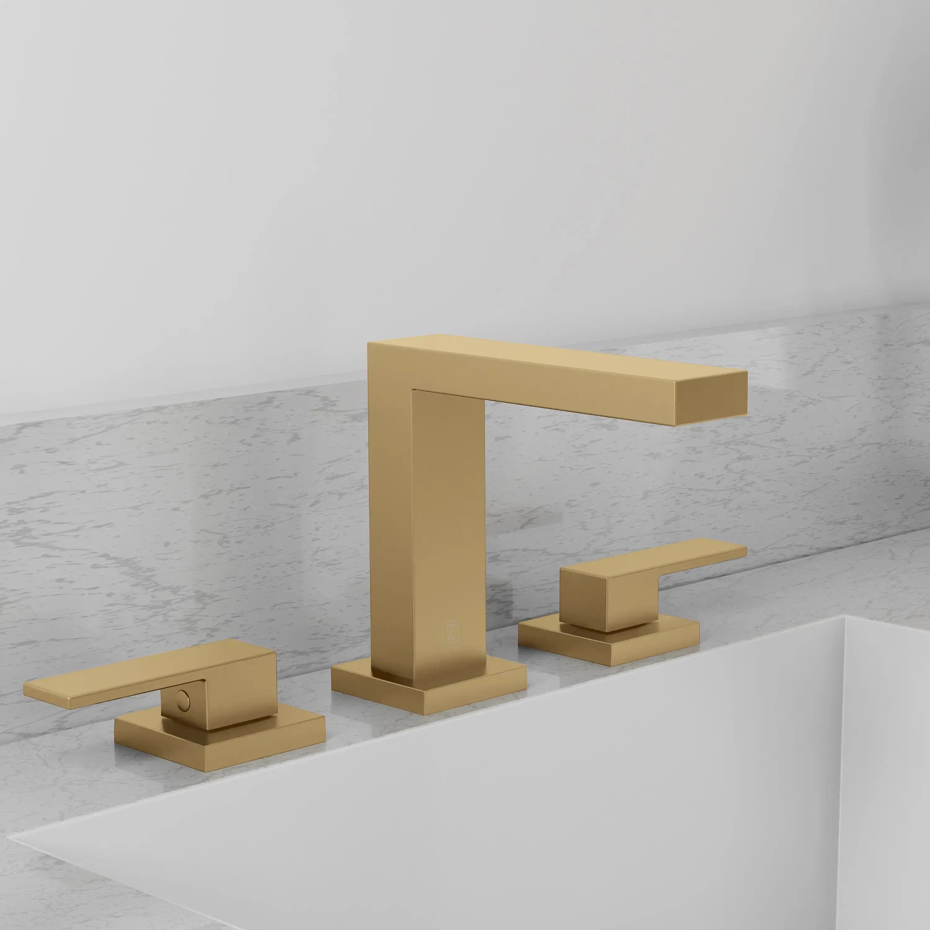 Champagne bronze widespread bath faucet on vanity with tall spout and two deck handles