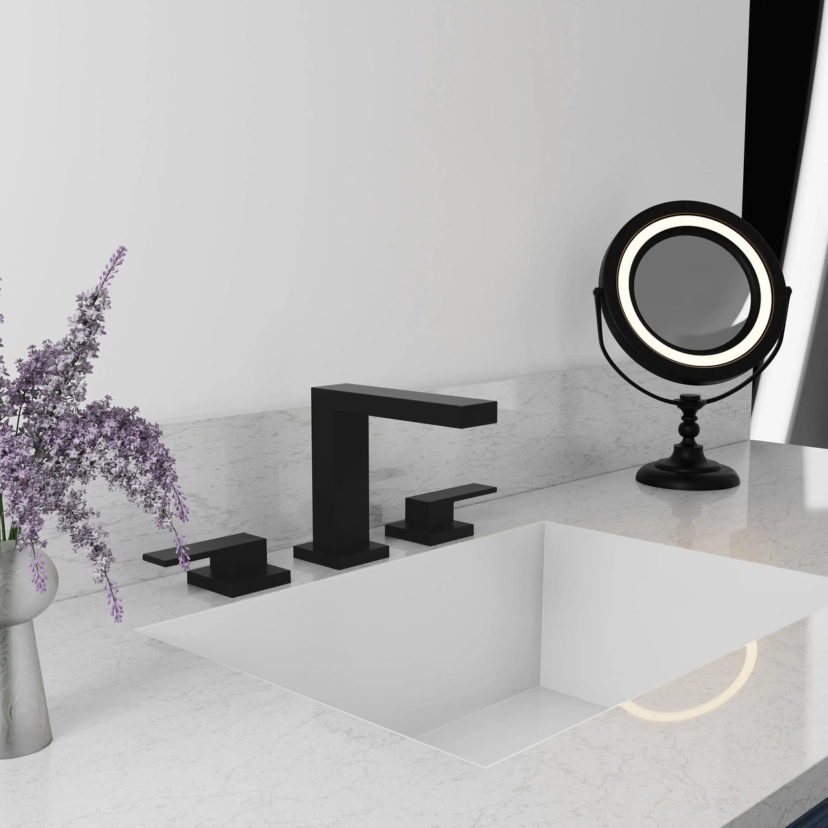 Matte black widespread bath faucet over a white sink with three-piece deck controls