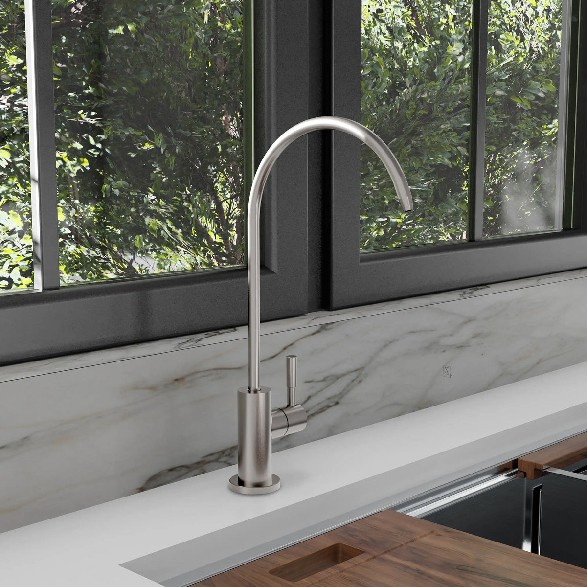 Brushed nickel tall gooseneck drink faucet with single handle on countertop