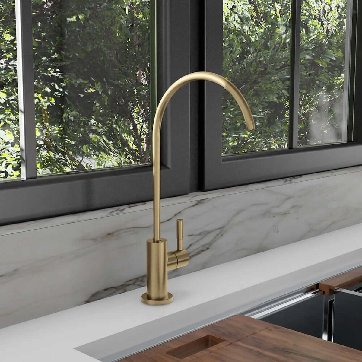 Champagne bronze single-handle drink faucet on countertop with tall curved spout