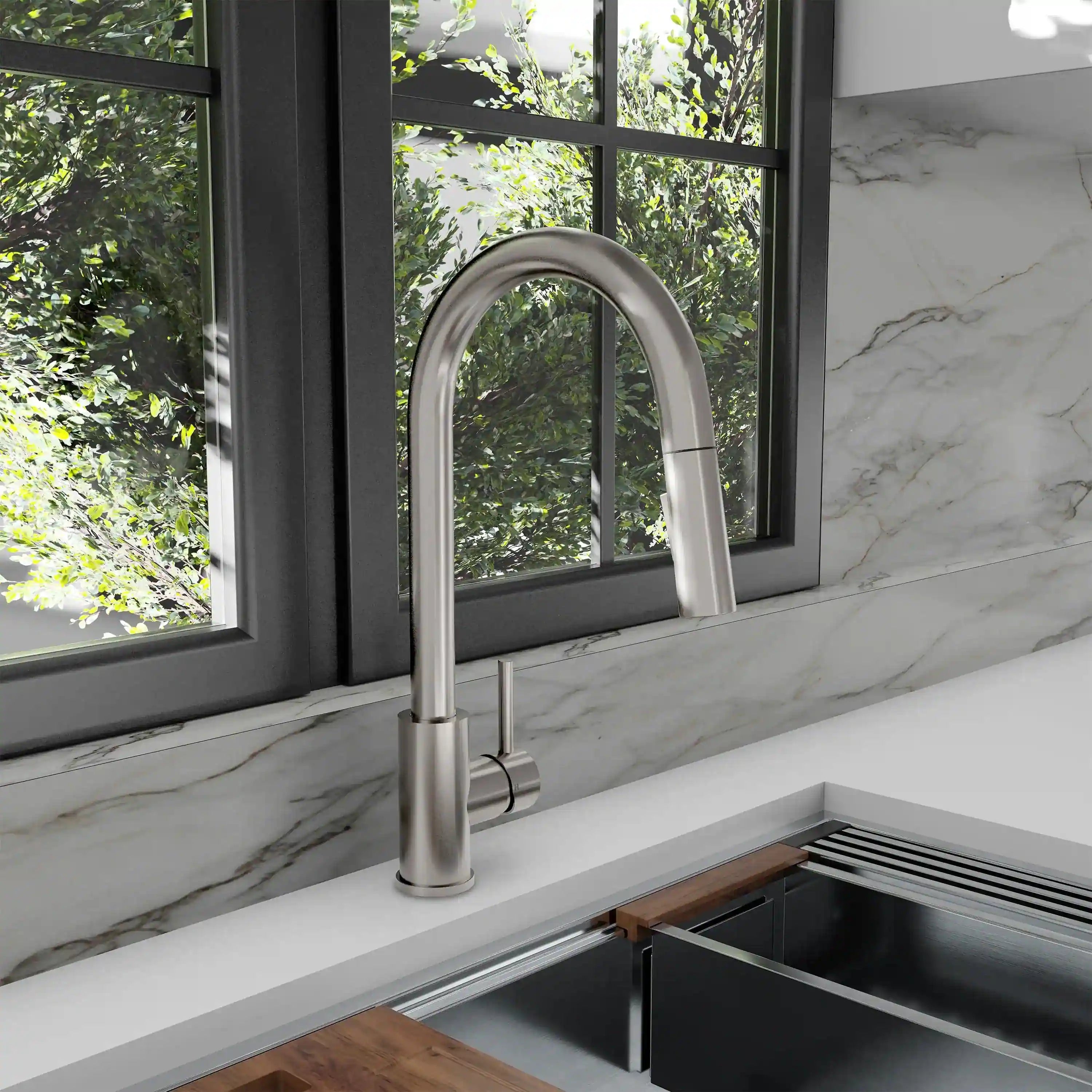 Brushed nickel pull-down kitchen faucet in a countertop installation with hose