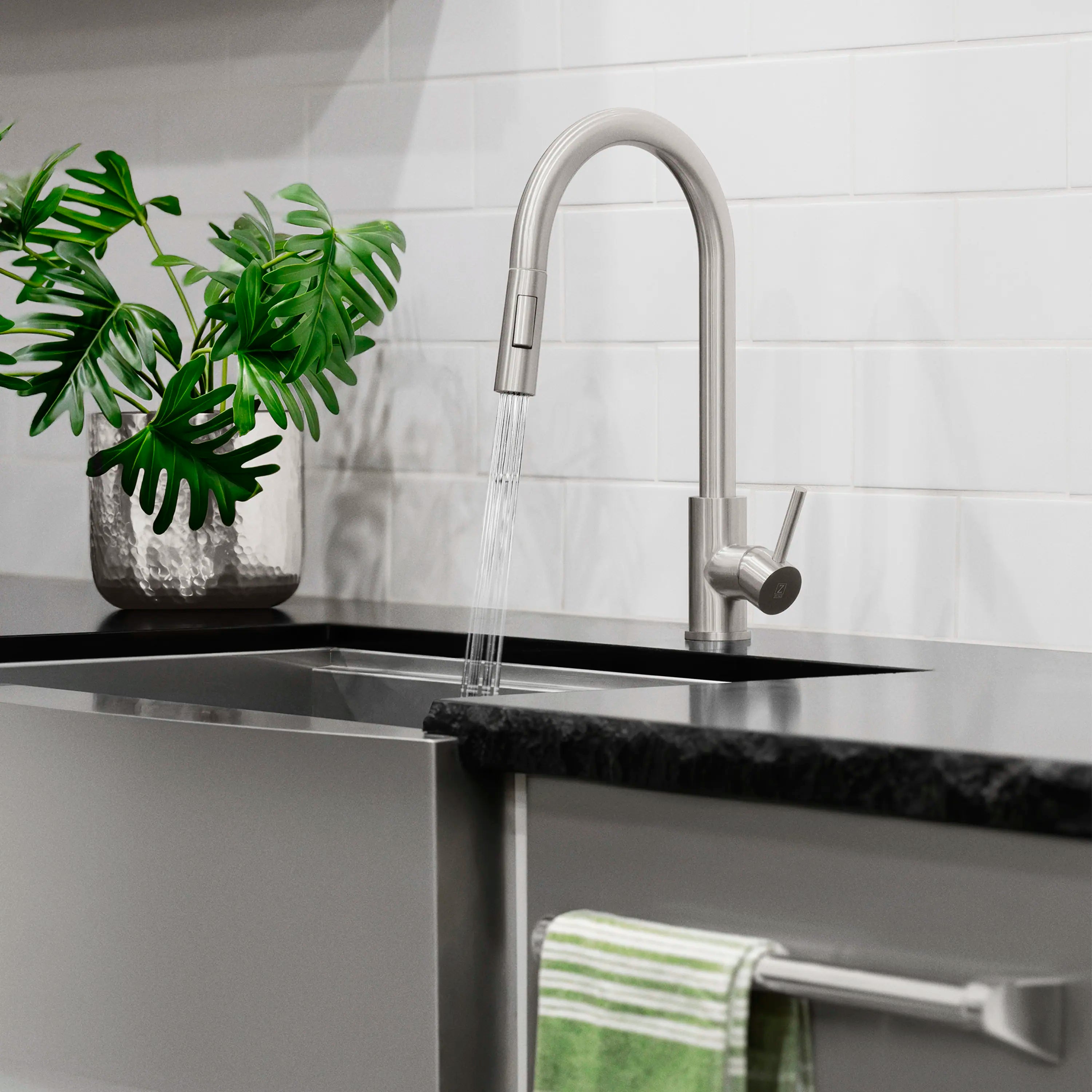 Brushed nickel pull-down kitchen faucet with single handle and arched spout