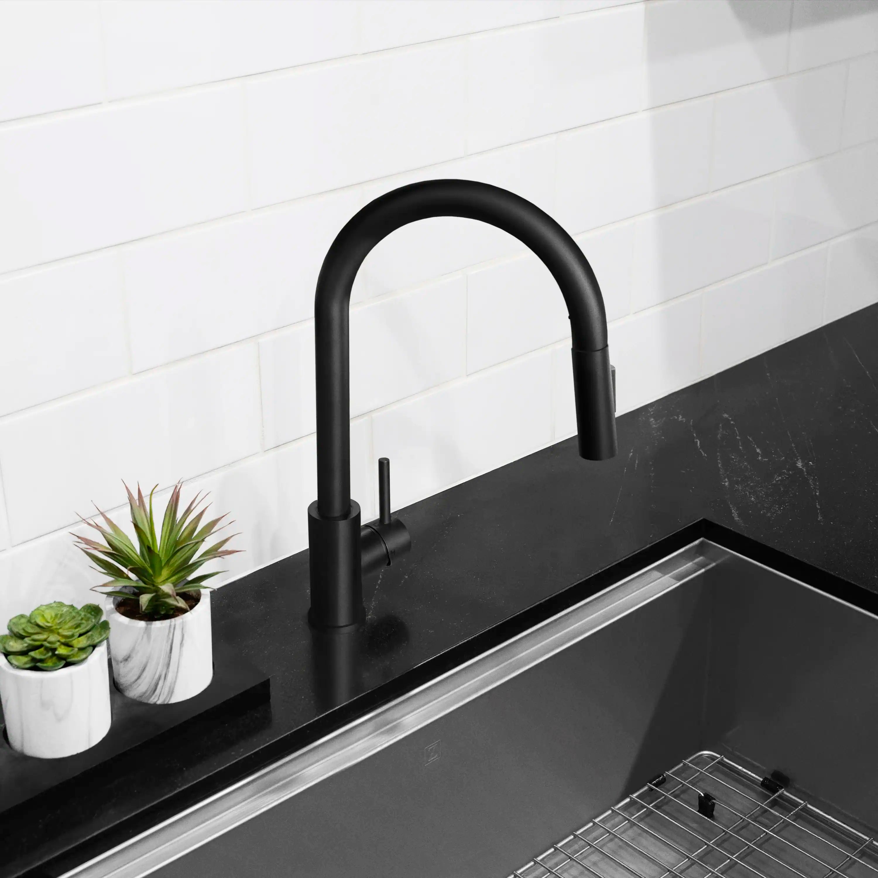 Matte black single-handle pull-down kitchen faucet with curved gooseneck spout