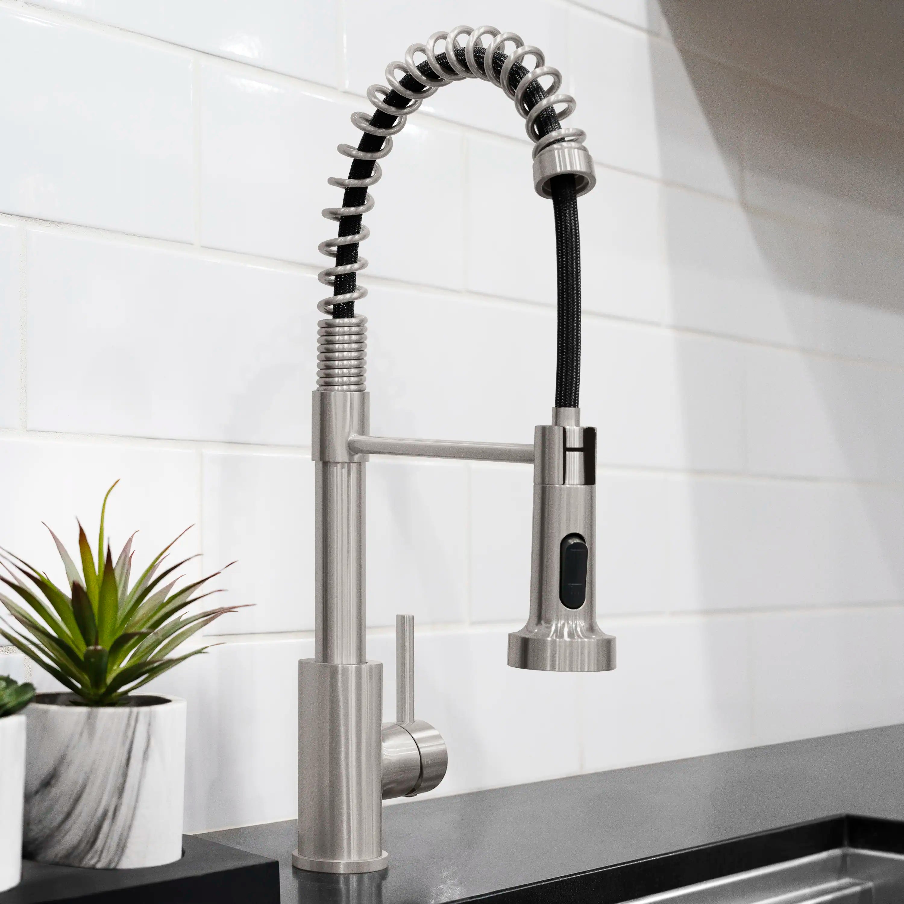 Brushed nickel pull-down kitchen faucet with black spray hose