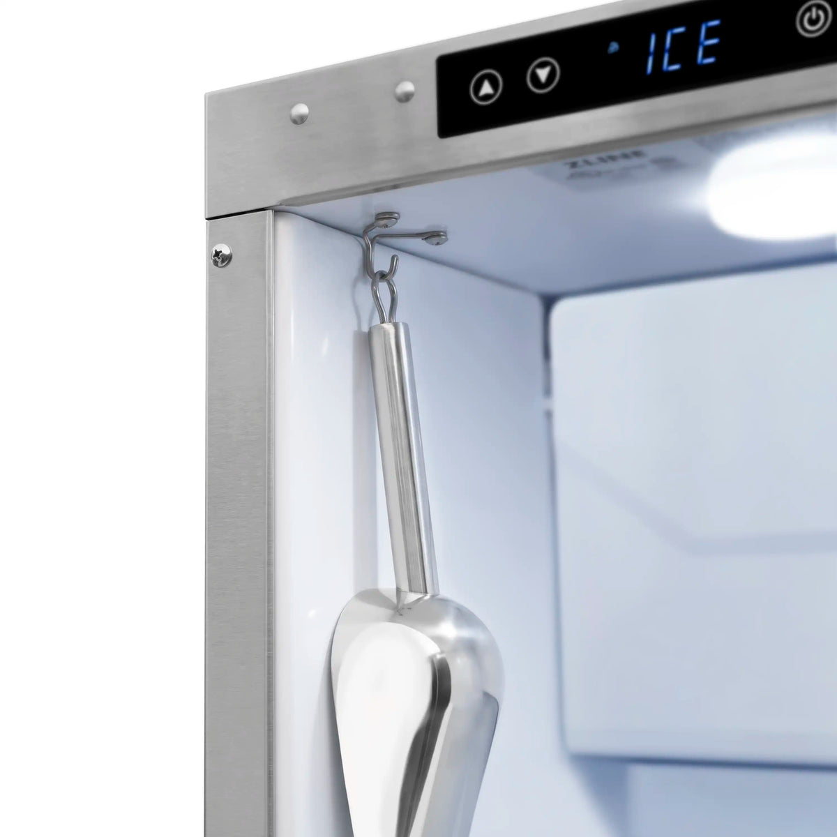 Stainless ice maker door with attached ice scoop hanging inside compartment