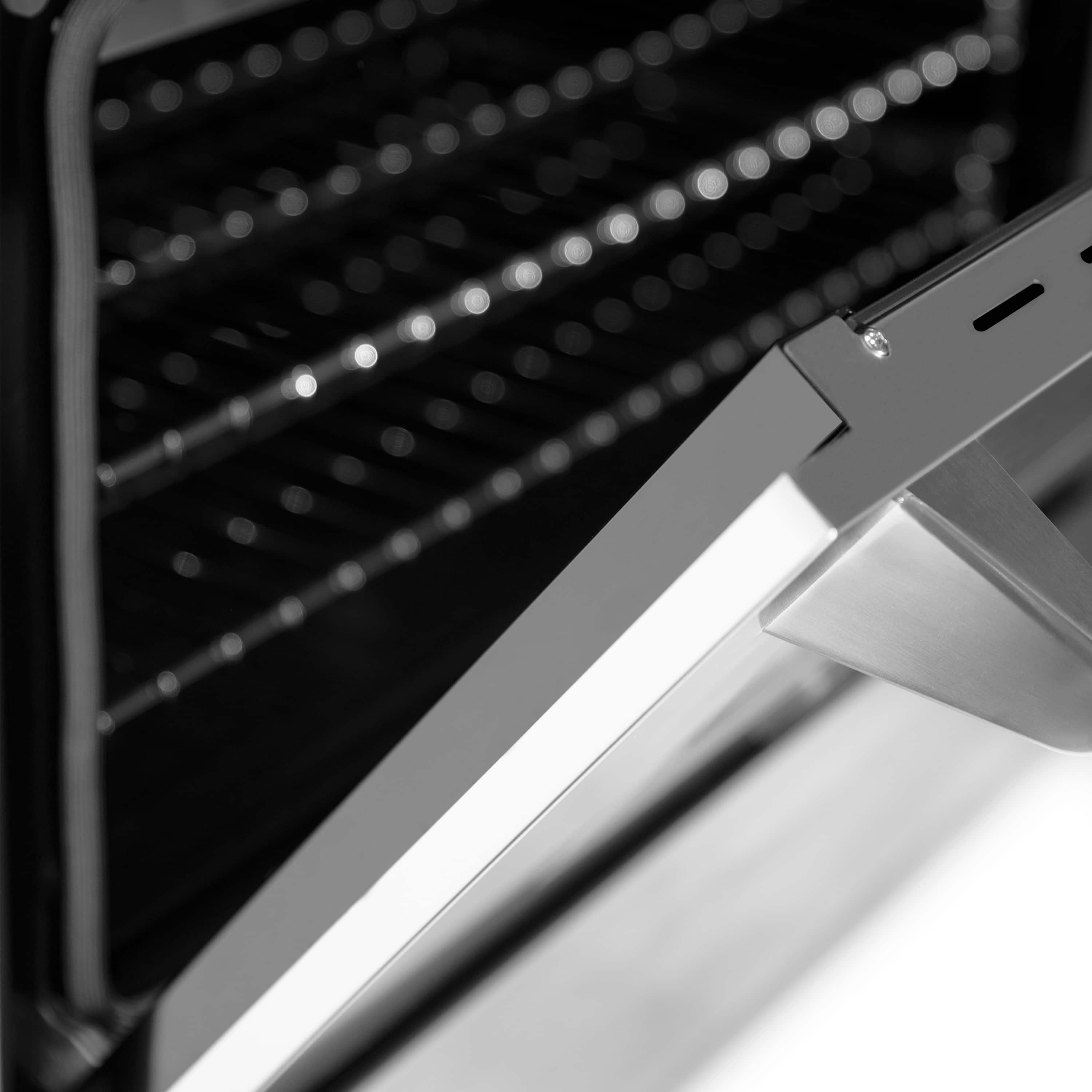 Stainless steel oven heating element and side rails inside oven cavity