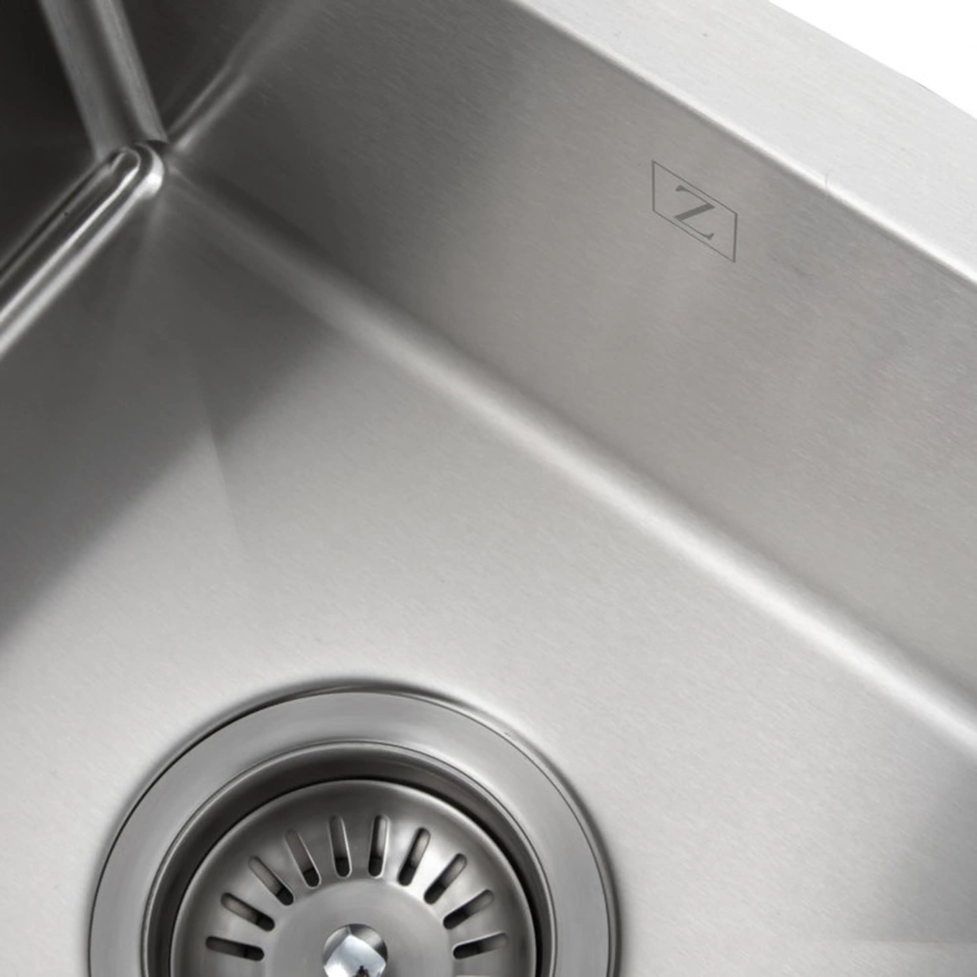 Stainless steel undermount single-bowl kitchen sink with circular drain and Z logo.