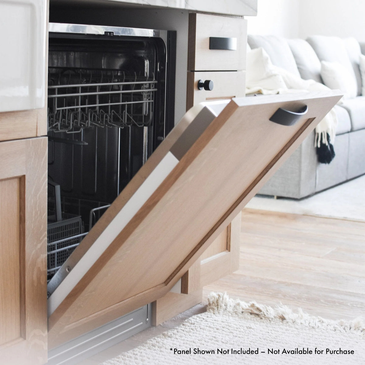Built-in dishwasher with open door, custom panel frame and interior racks visible