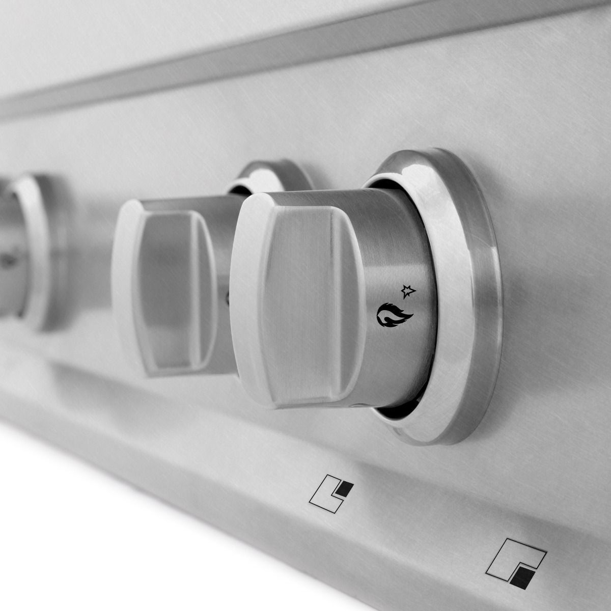 Stainless steel gas range control knob detail with icons