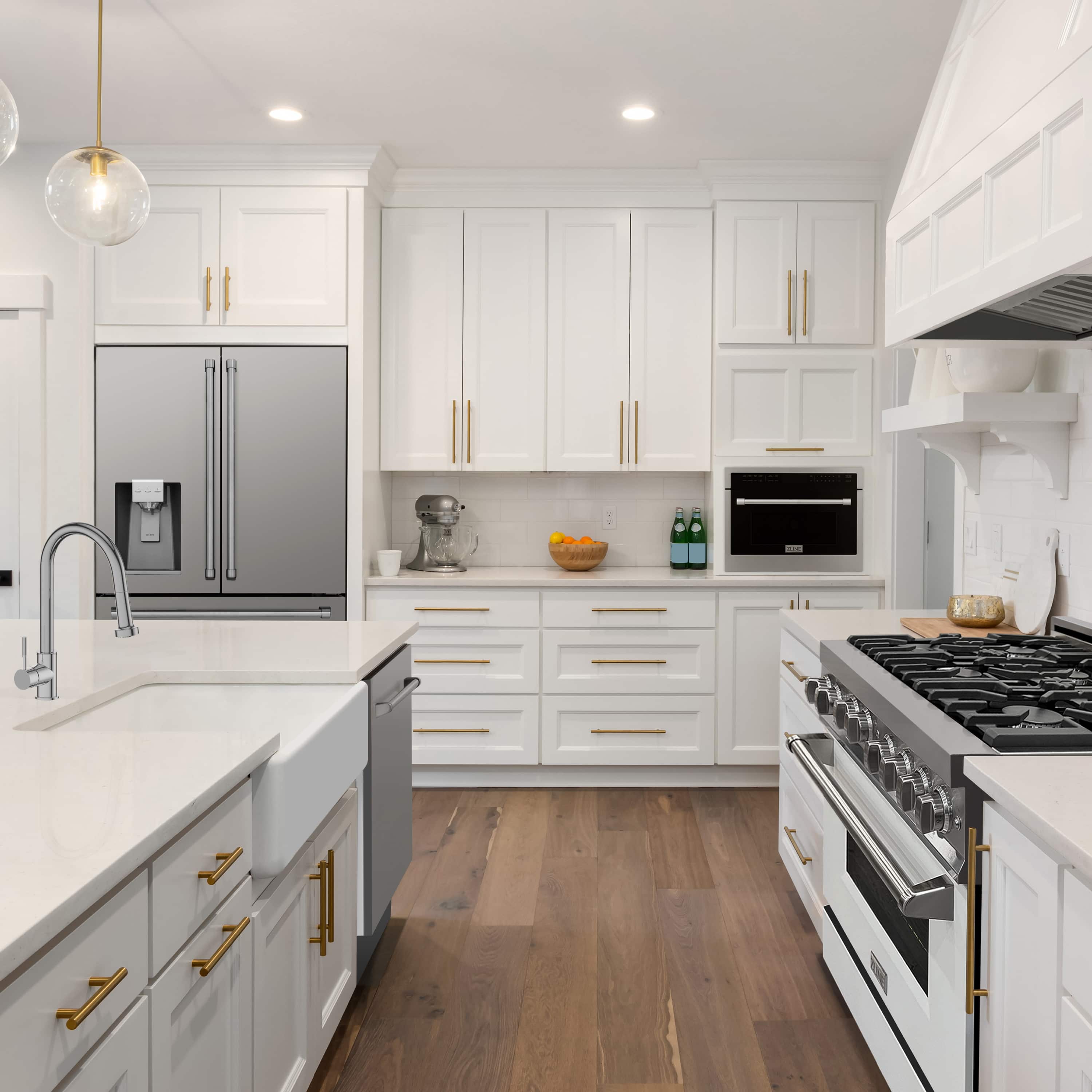 Stainless steel refrigerator with top-freezer and adjacent dual fuel range in kitchen