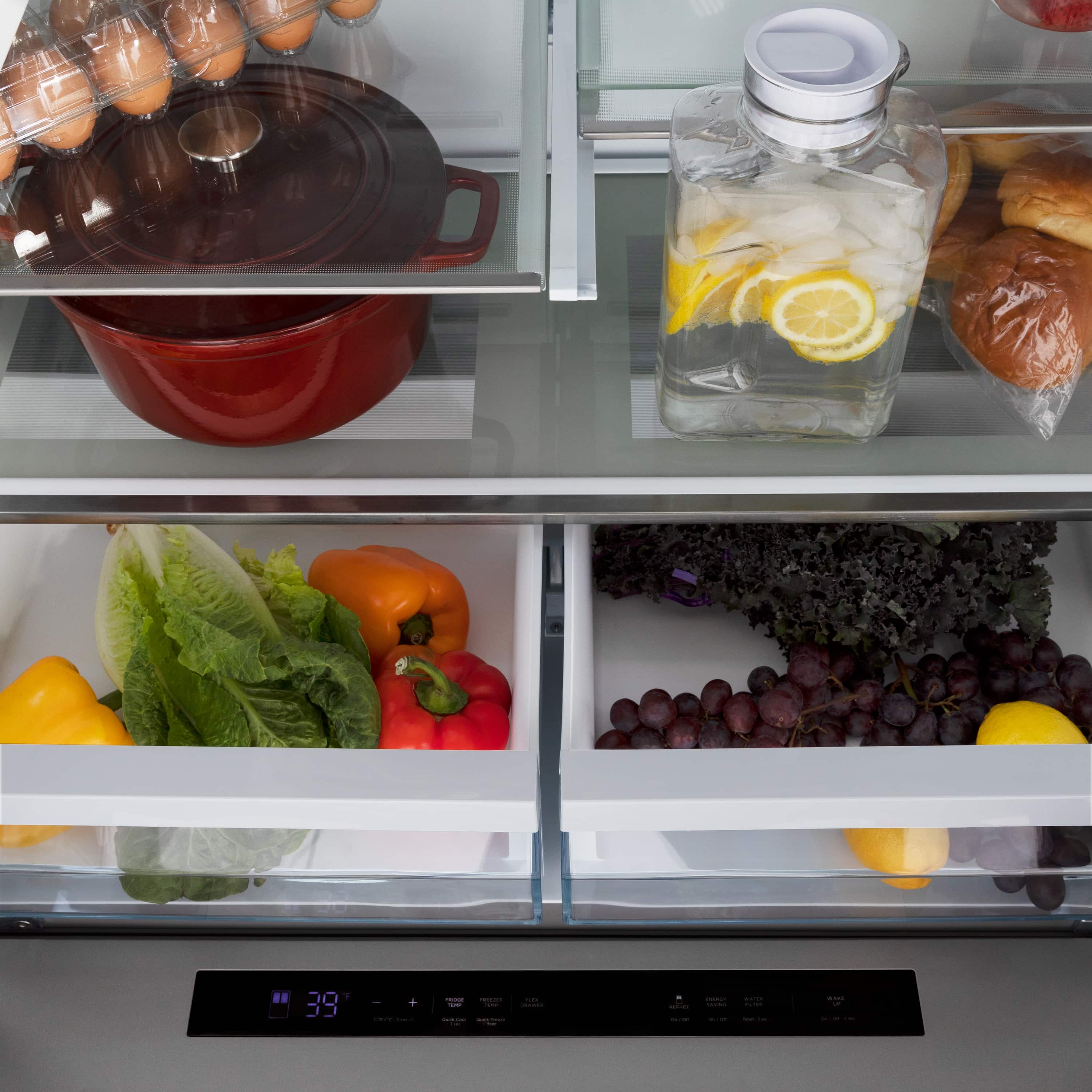 Refrigerator interior with produce bins and lower drawer compartments