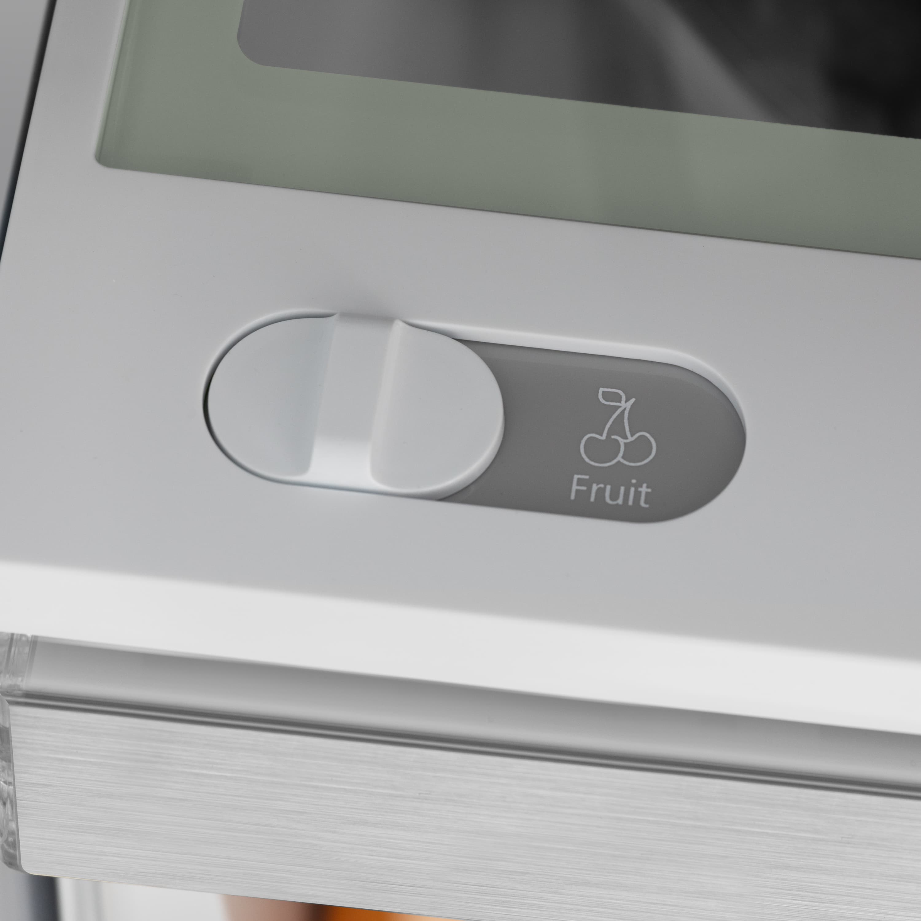 Fruit crisper drawer with "Fruit" label and white pull handle