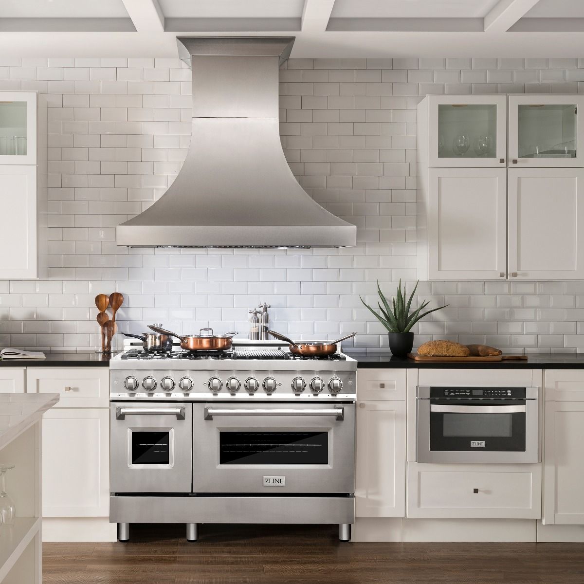 Stainless steel dual fuel range with gas cooktop and two oven doors, centered