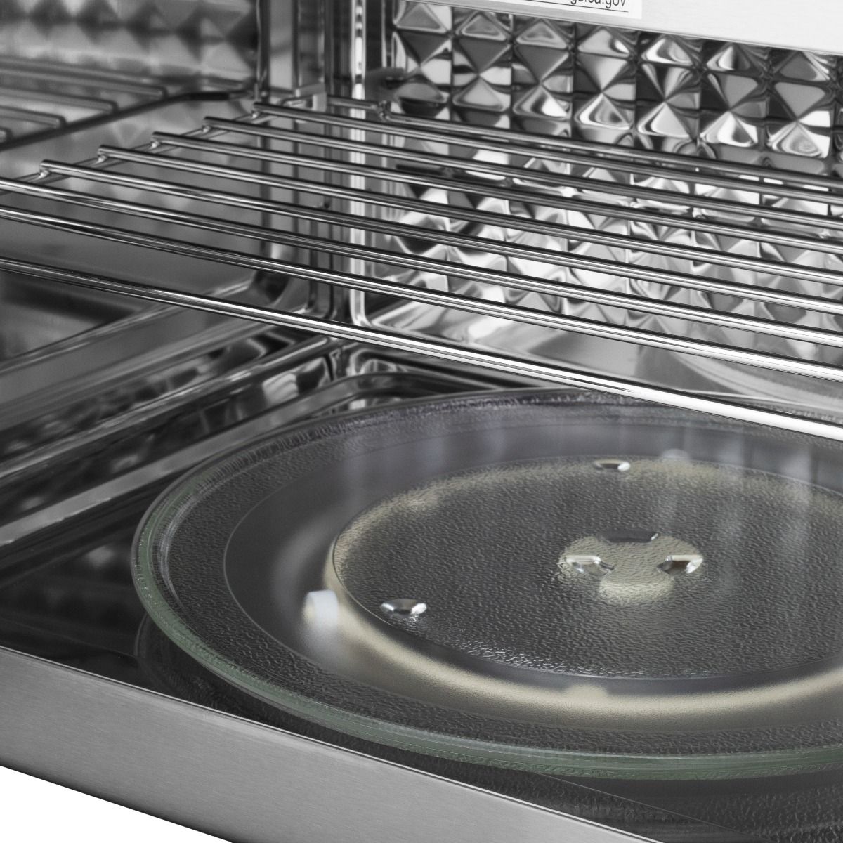 Double wall oven interior with wire rack and clear glass baking dish