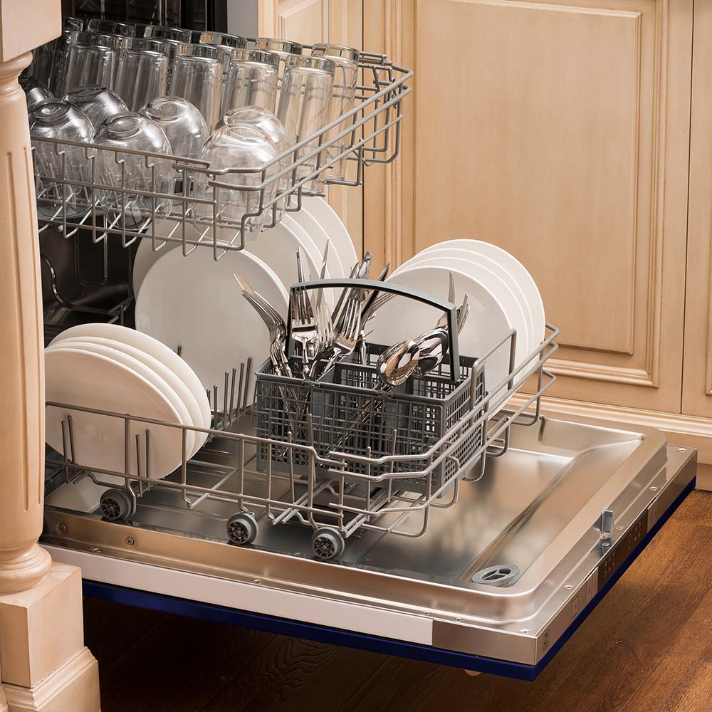 Open dishwasher with loaded racks, plates, and silverware in stainless tub