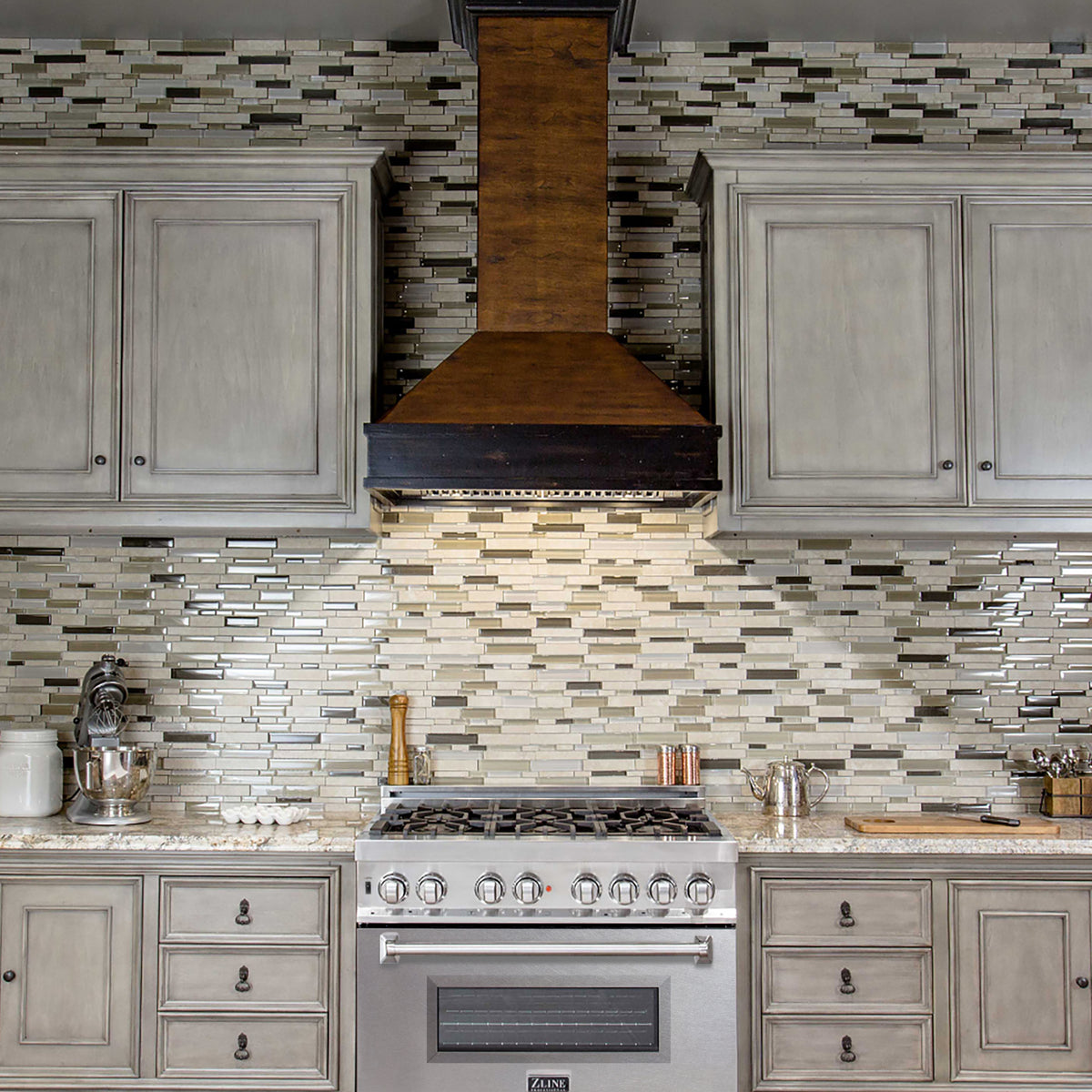 Satin stainless dual fuel range with multiple cooktop burners and oven door