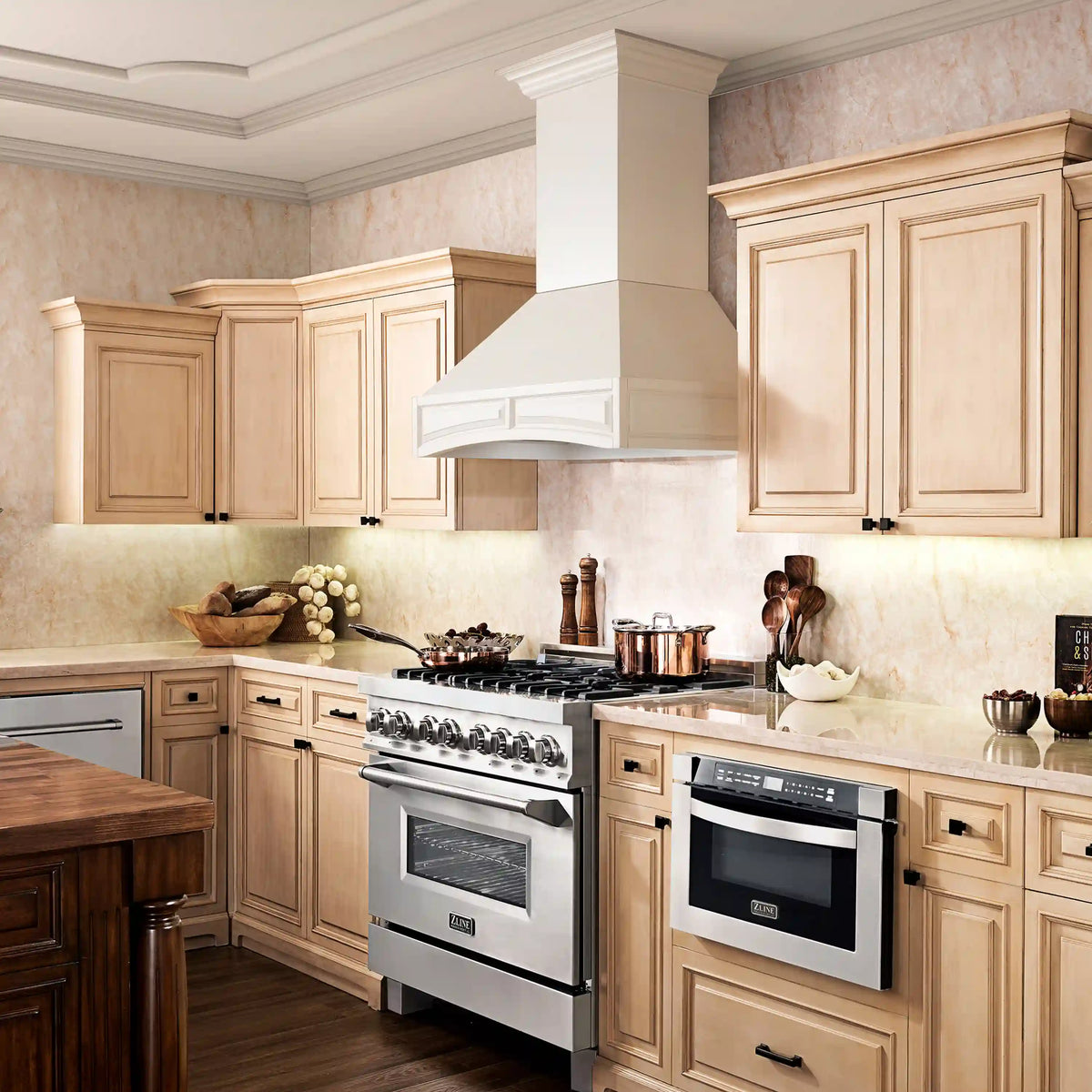 White wall-mounted range hood chimney with flared canopy and vent grille