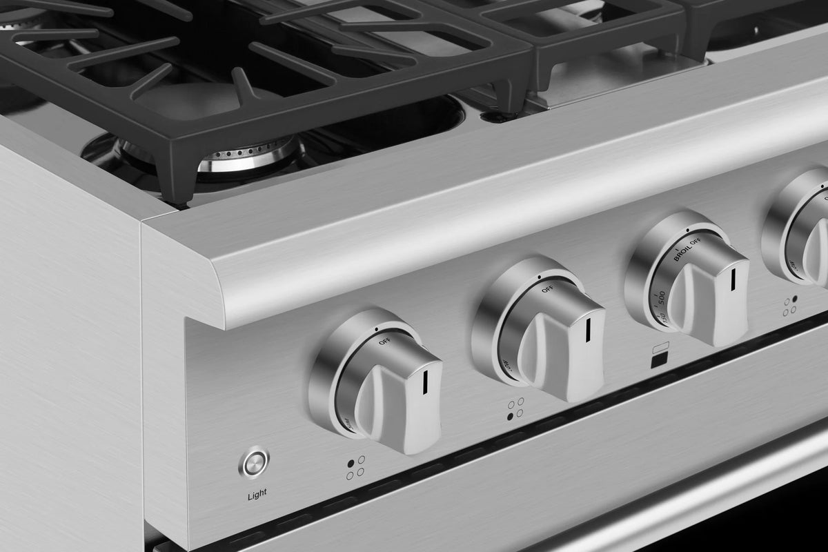 Stainless steel gas range front with five rounded control knobs along the cooktop
