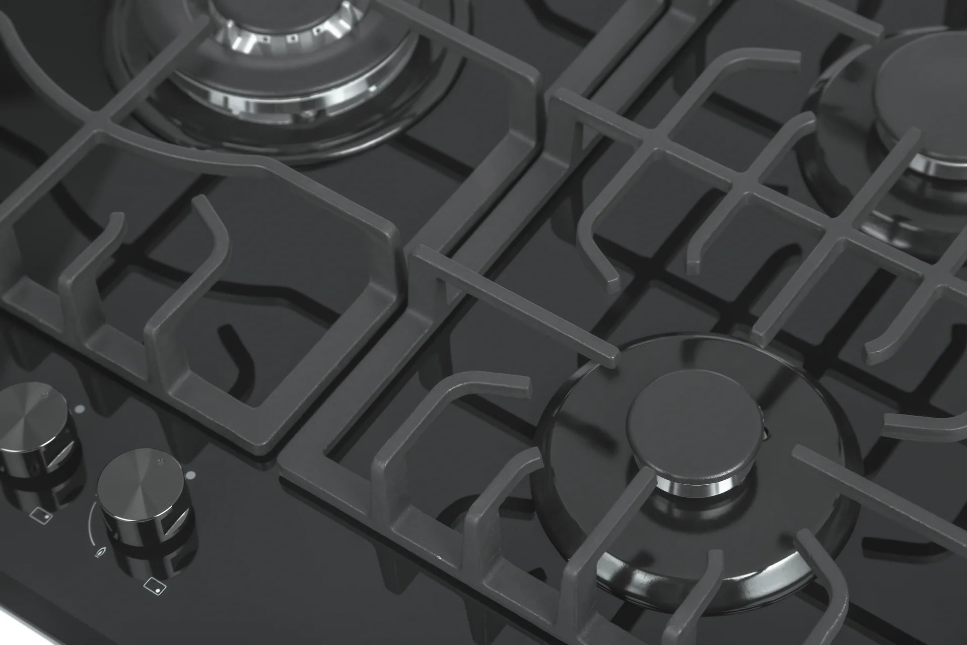 Close-up of black cooktop grates, burner rings, and front control knobs