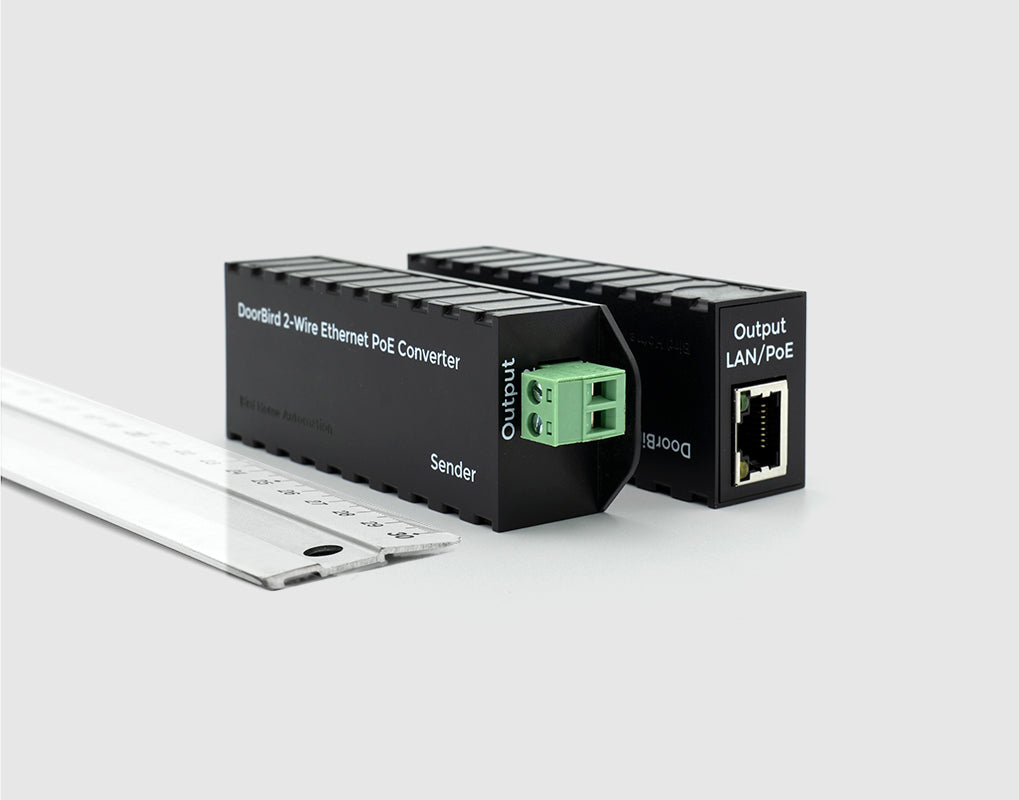 DoorBird 2-Wire Ethernet PoE converter with green terminal and RJ45 port, angled
