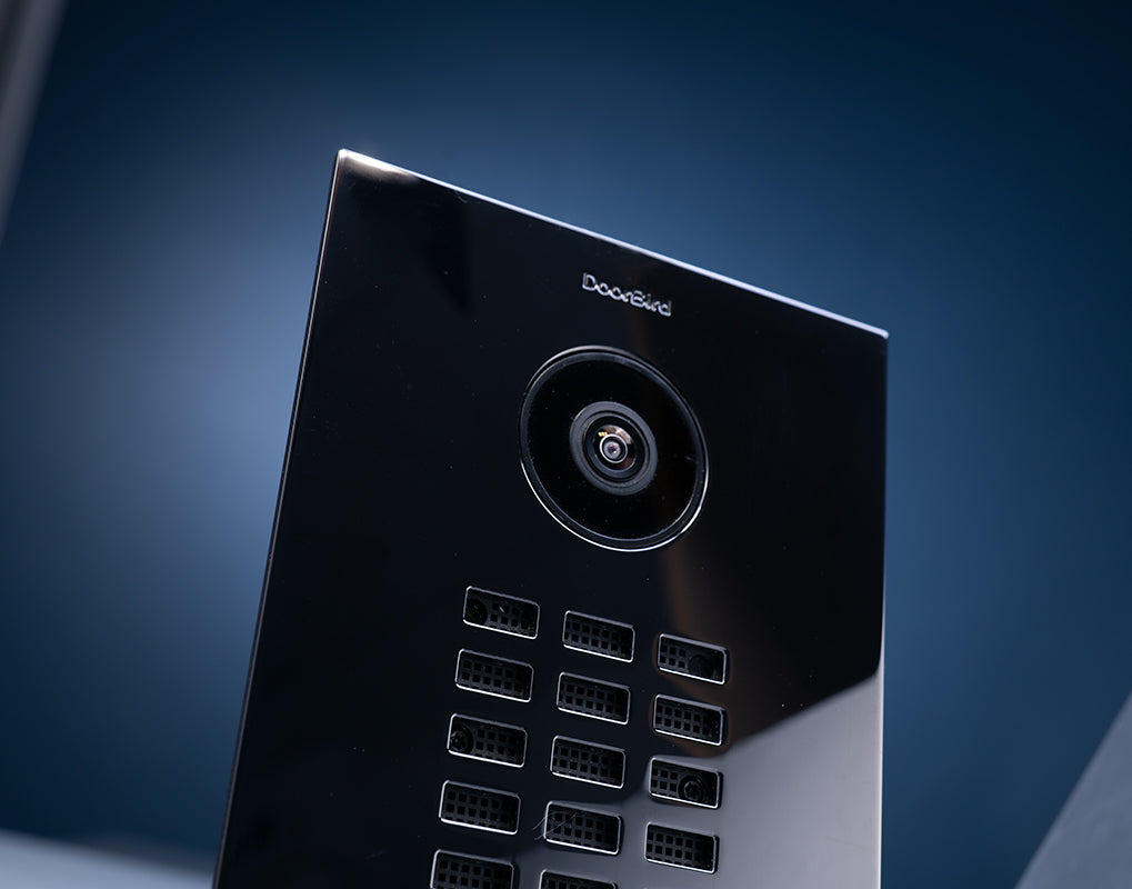 DoorBird video door station front panel with camera lens and address keypad