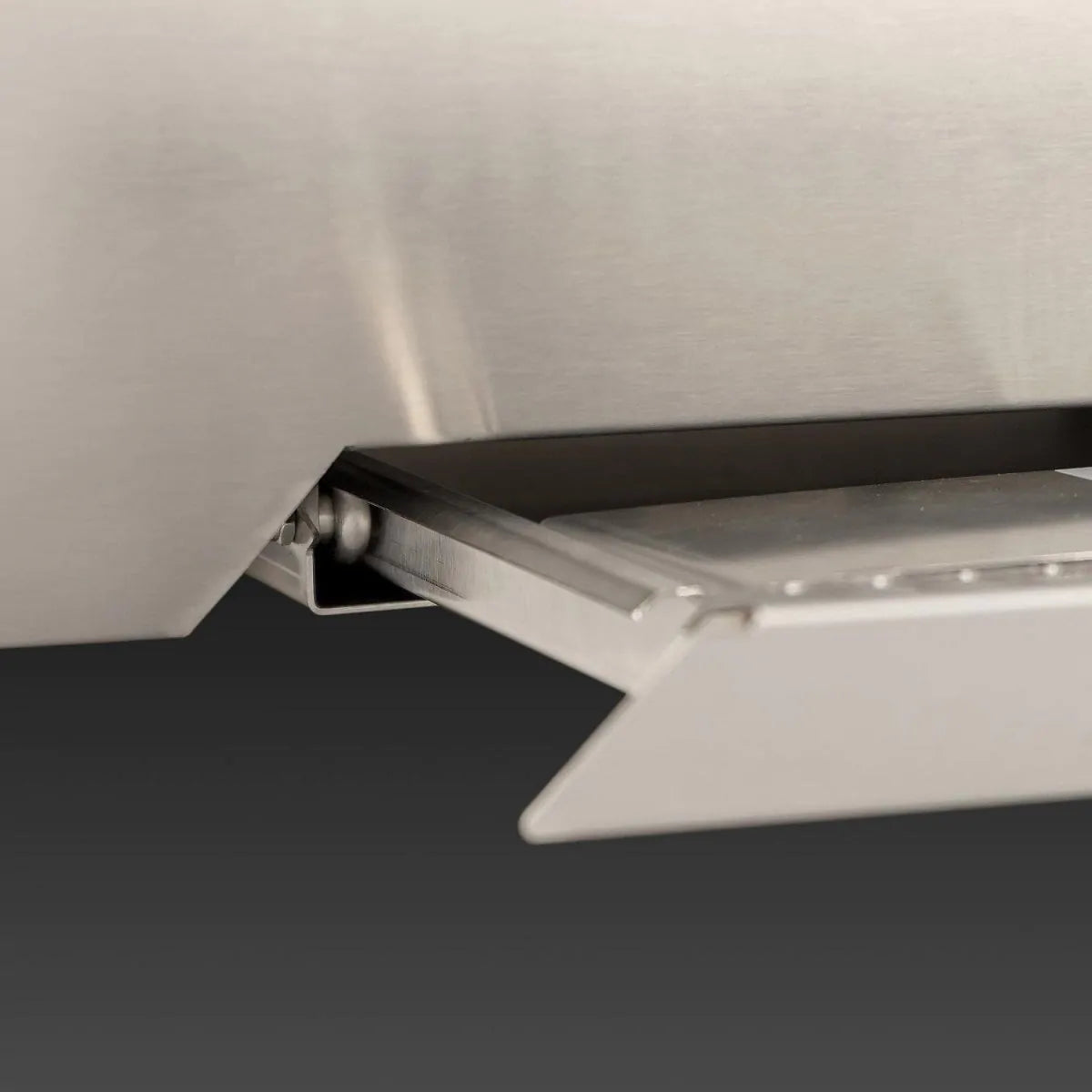 Stainless grill hood interior with angled underside and airflow vent cover