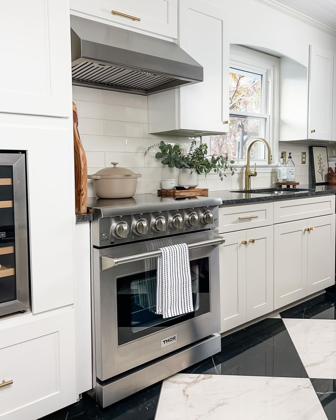 Stainless steel electric range with front control knobs and oven door.