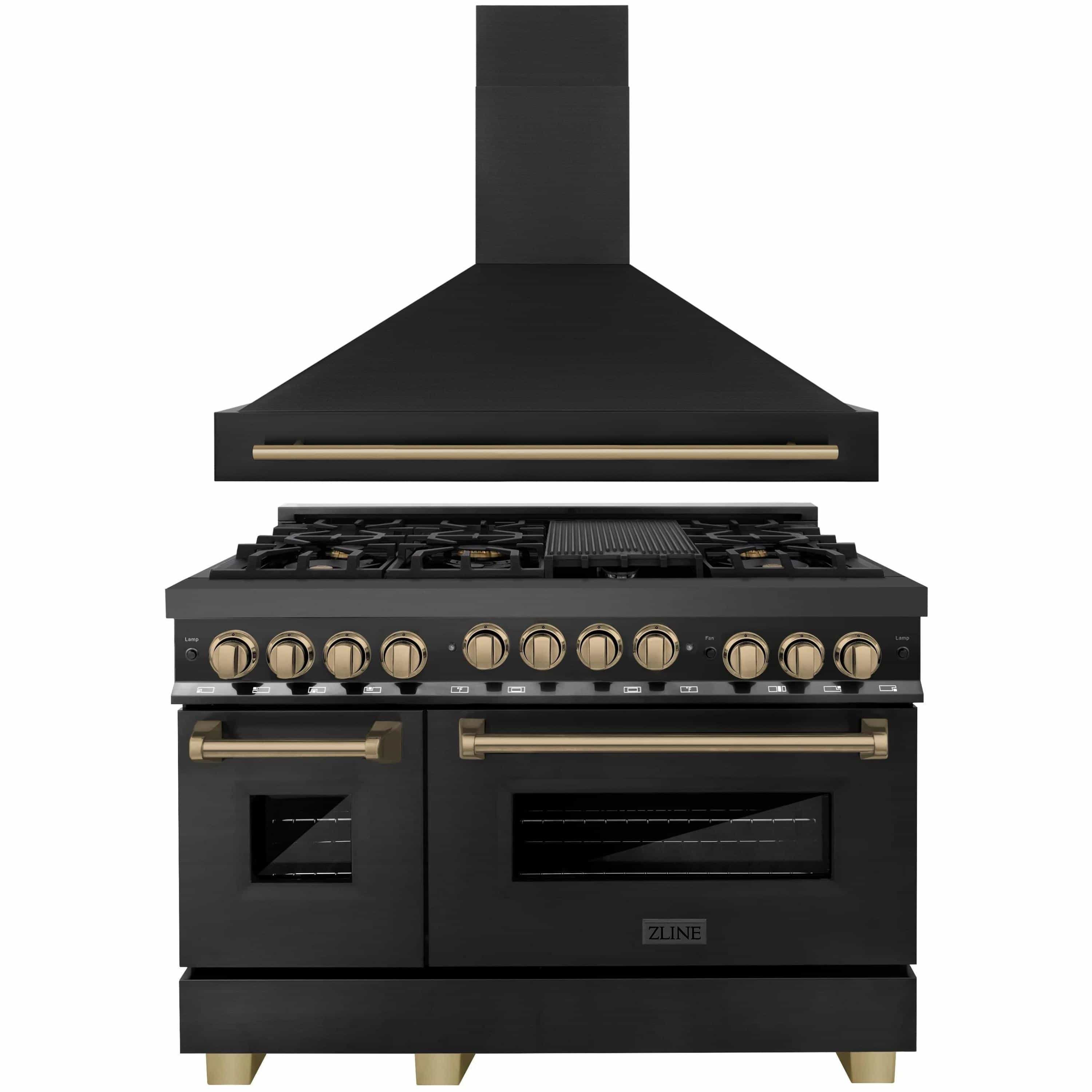 Black dual fuel range with wall hood and champagne bronze trim, stainless control knobs