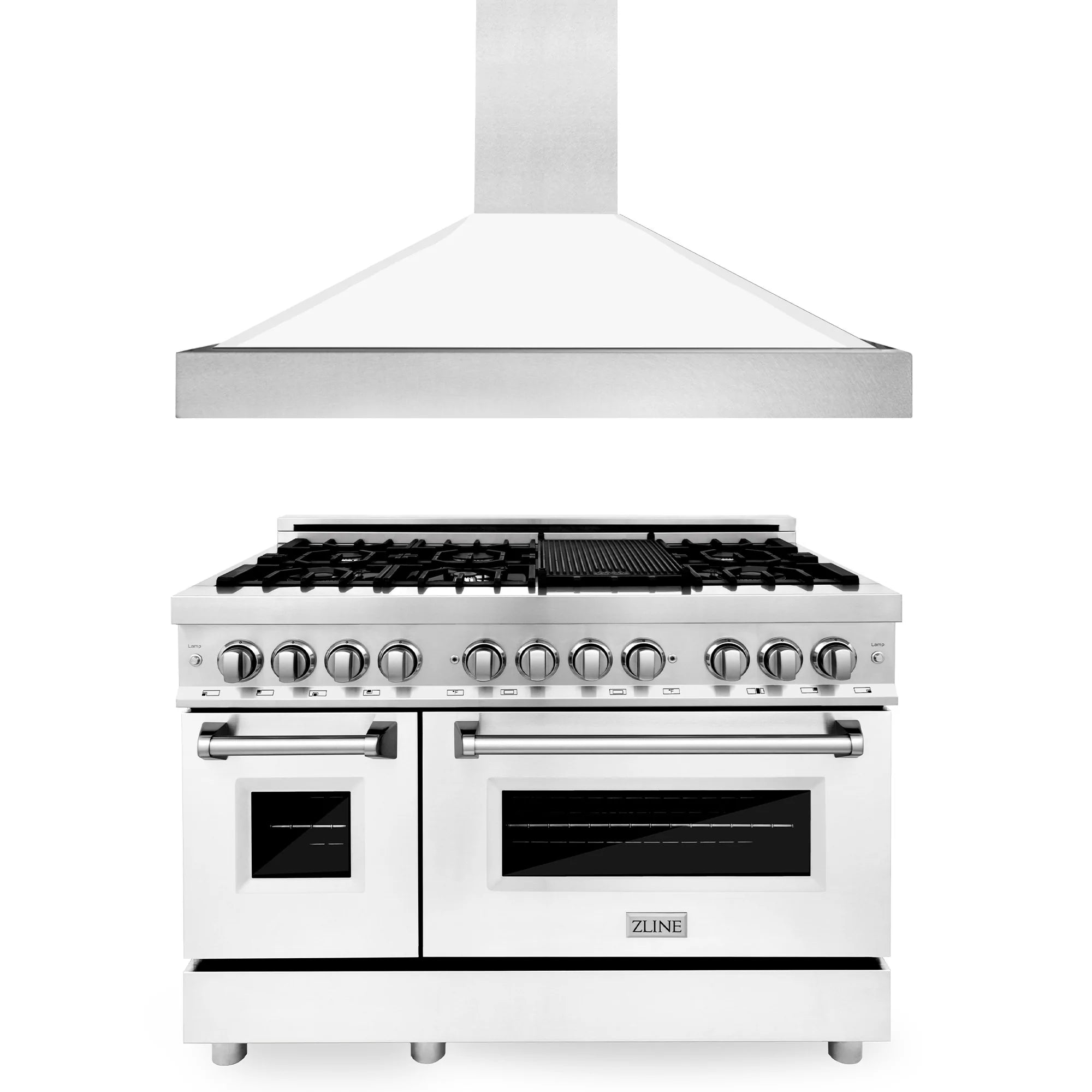 White dual-fuel range with stainless knobs and black grates under a vent hood