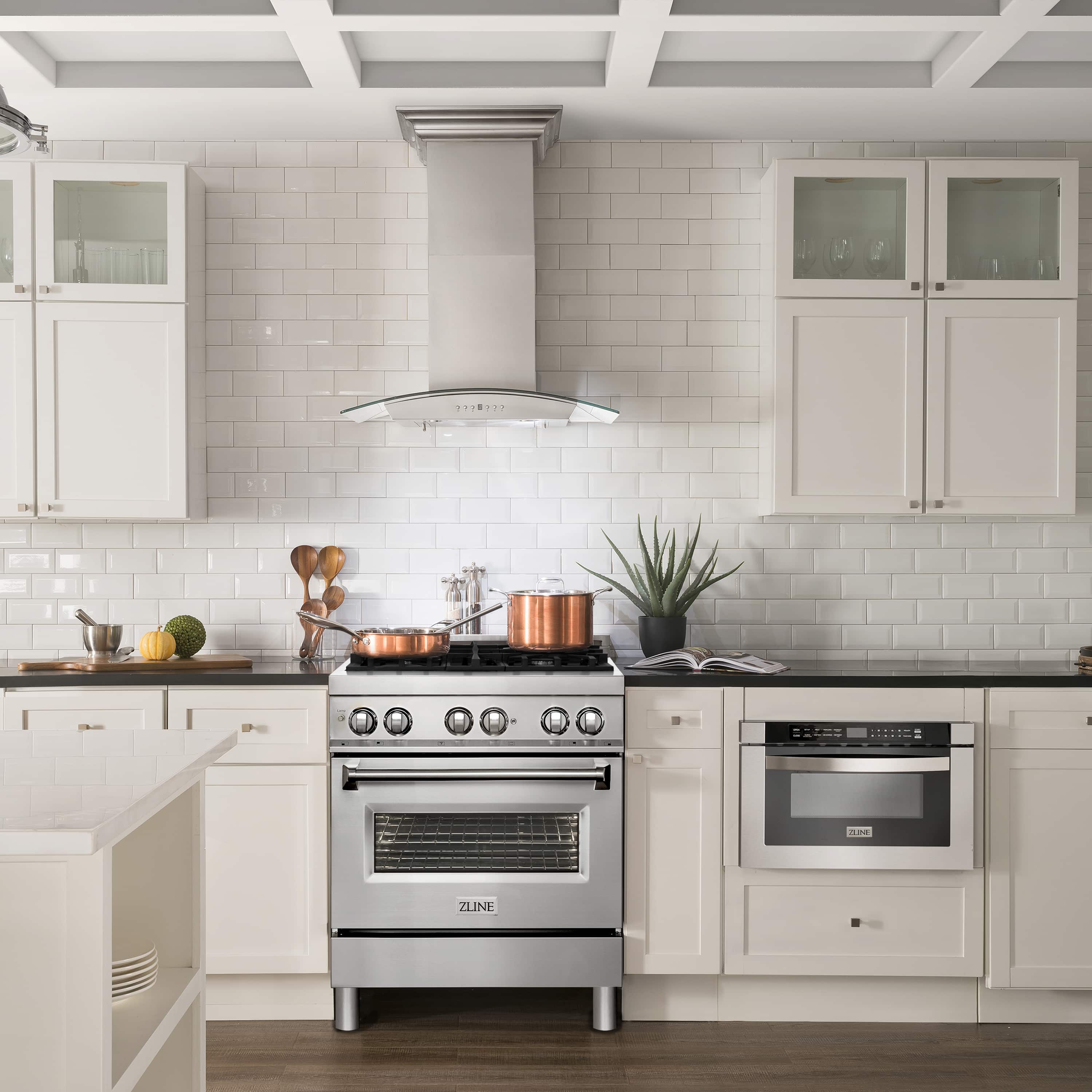 ZLINE dual fuel range with over-the-range vent hood and microwave in kitchen