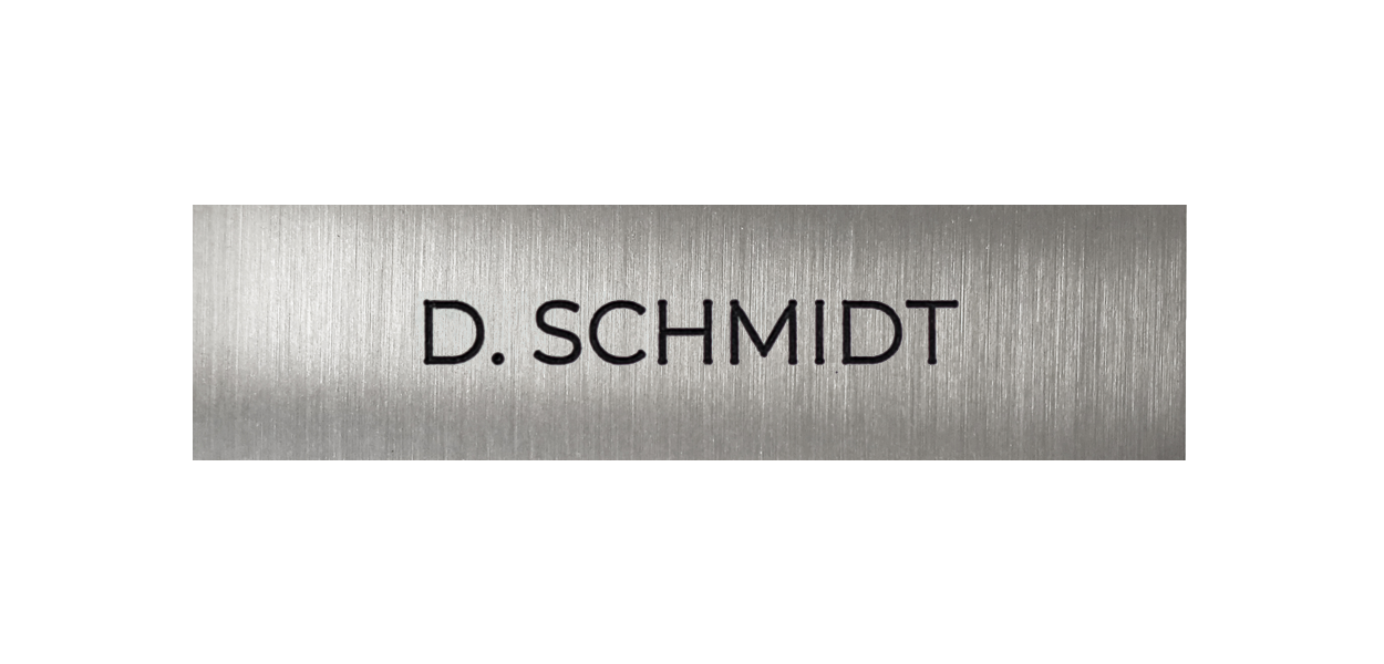 Stainless steel nameplate with engraved text "D. SCHMIDT"