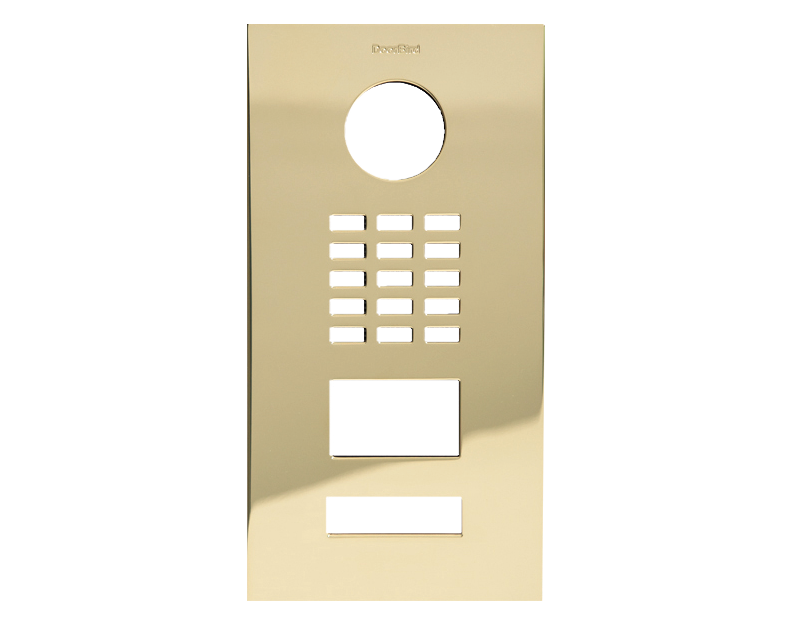 DoorBird brass front panel with round lens opening, button grid, and display cutouts