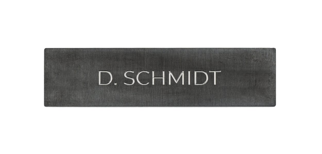Titanium-coated stainless steel nameplate with engraved D. SCHMIDT