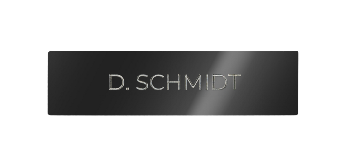 Dark stainless steel nameplate with engraved “D. SCHMIDT” lettering