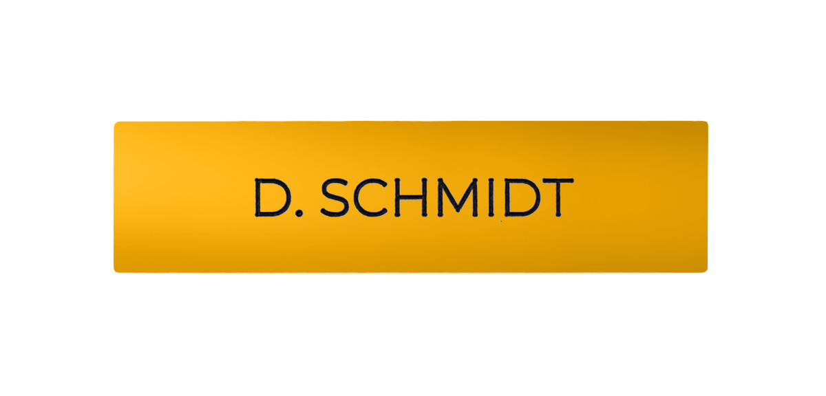 Golden yellow doorbell nameplate with engraved text D. SCHMIDT