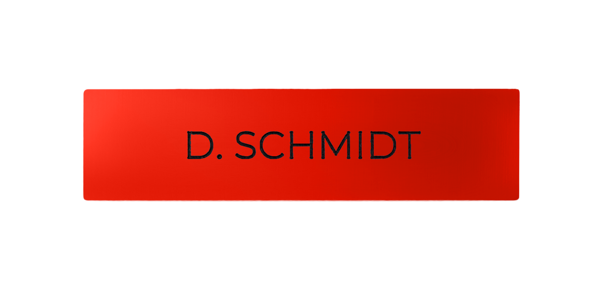 Red nameplate with engraved text “D. SCHMIDT”