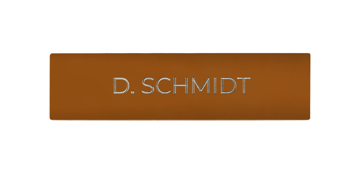 Orange-brown engraved door nameplate with white text lettering