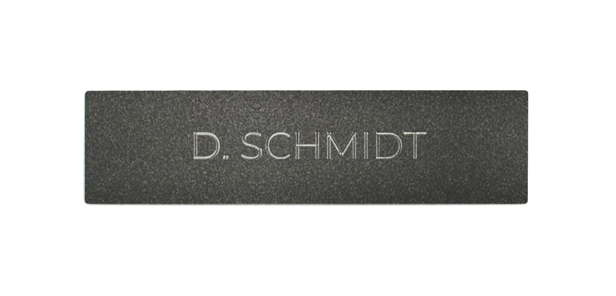 Stainless steel nameplate with engraved D. SCHMIDT lettering