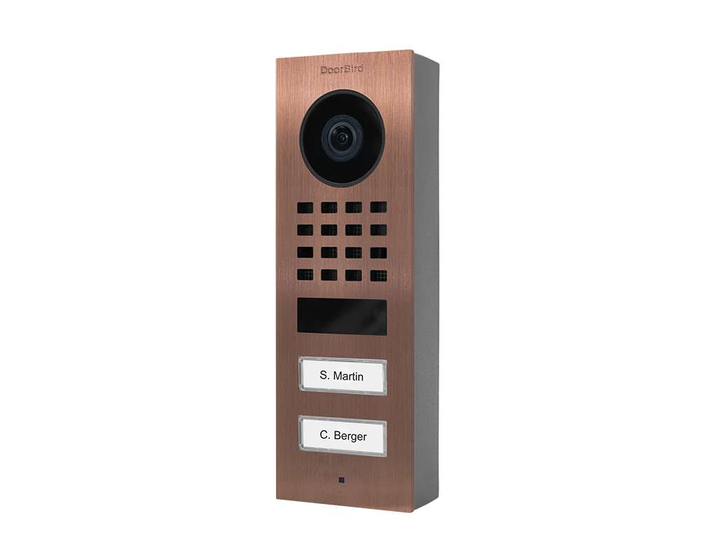 Bronze surface-mount IP video door station with camera lens, call buttons, and nameplates
