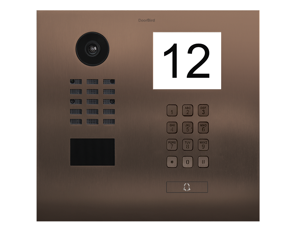 DoorBird IP video door station in bronze, with camera lens, keypad, and call button