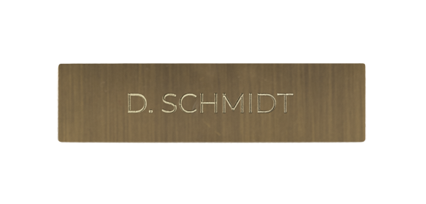 Burnished brass nameplate with engraved 'D. SCHMIOT'