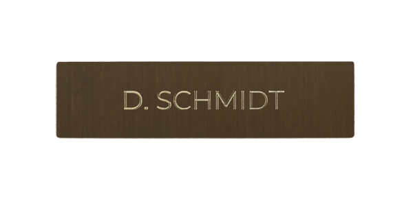 Architectural bronze nameplate with engraved 'D. SCHMIDT' lettering
